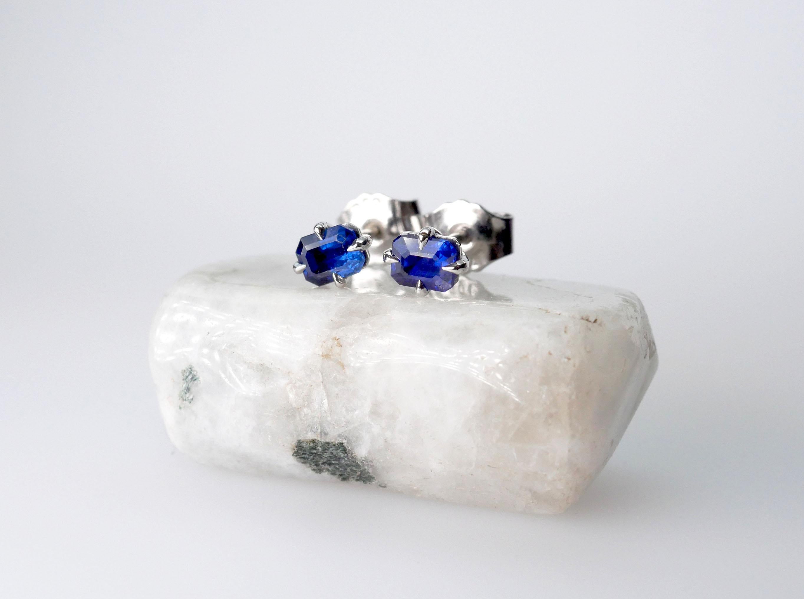 Handmade solitaire royal blue sapphire stud earrings in 18k white gold. Simple and elegant with talon-shaped claws and a close setting perfect to wear solo or stacked.

Total Sapphire Weight 2/1.10 Carat