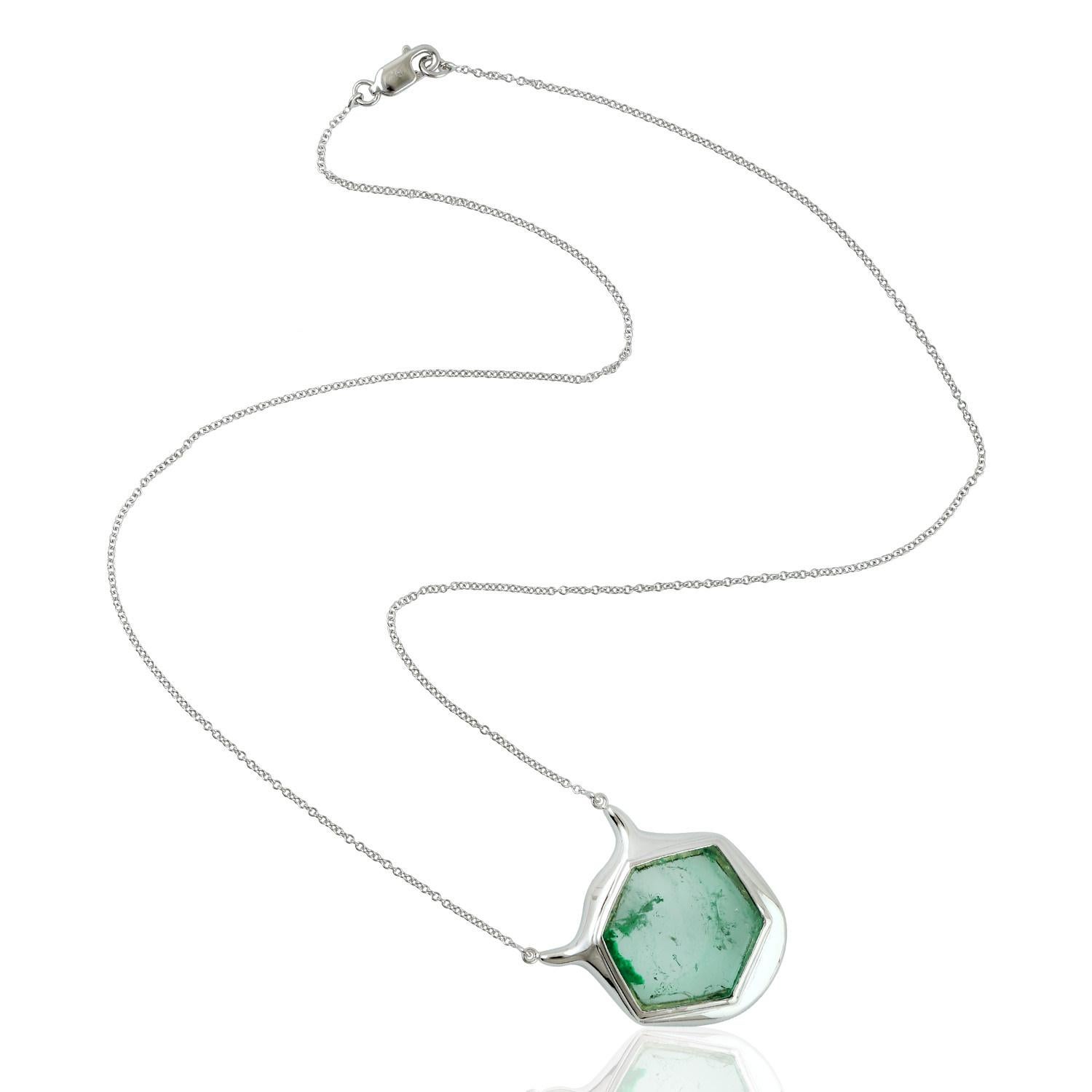 Octagon shape Muzo Emerald Necklace set in White 18K Gold is sweet and perfect to stack.

18KT Gold: 11.060gms
EMERALD: 18.50cts
