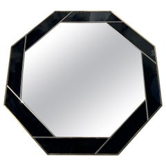 Octagon-shaped aperture mirror with an acrylic brass and black frame