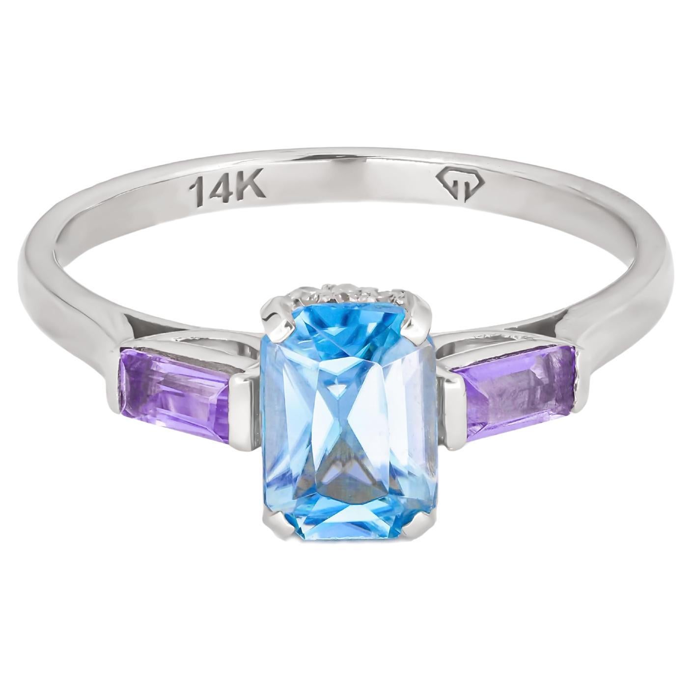 Octagon topaz 14k gold ring.