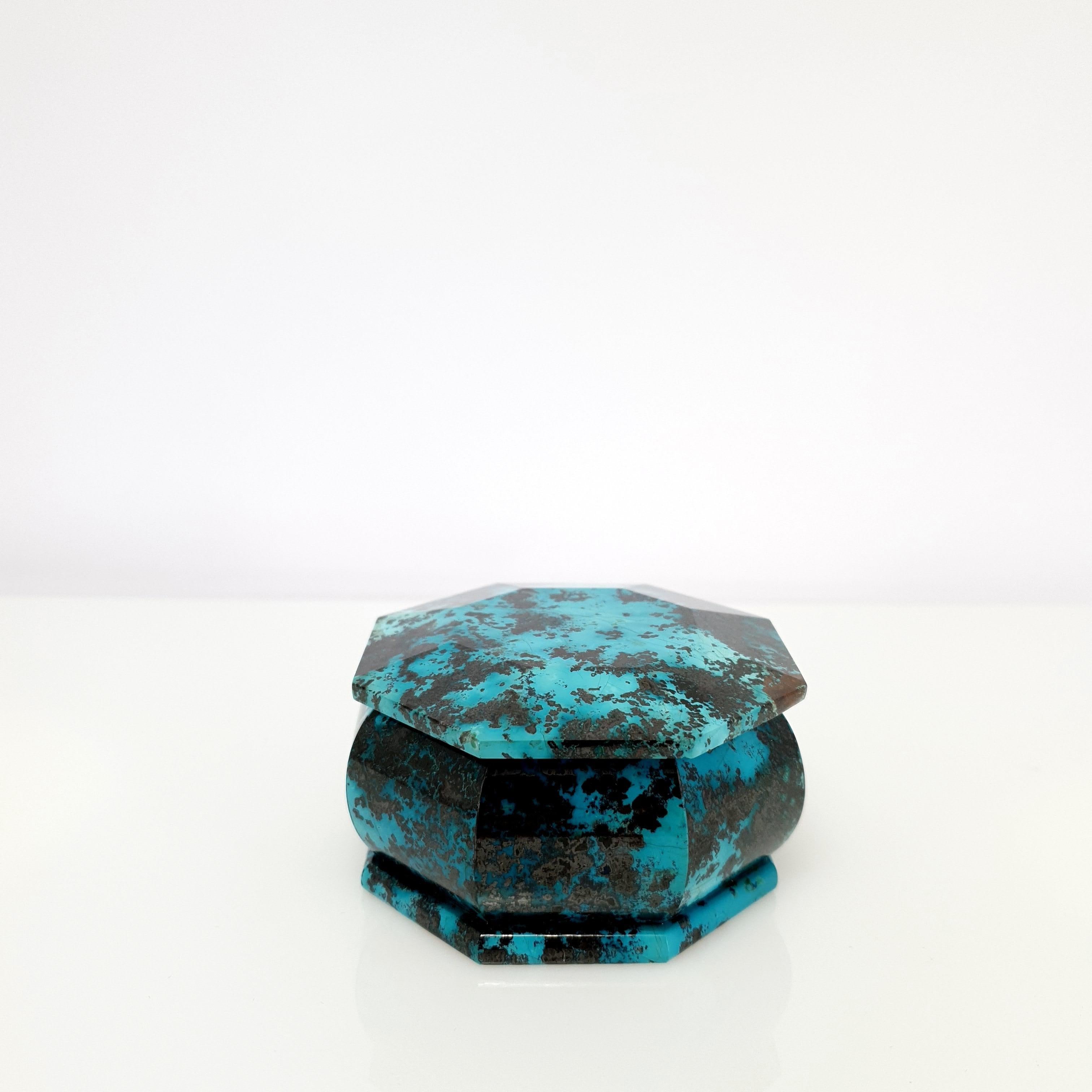 A Natural Handmade octagon turquoise coloured Shattuckite Decorative Jewelry Box.
The turquoise colour and the black pattern looks like an artful painting of nature. 
Shattuckite is a mixed mineral of Chrysokoll, Malachite and Dioptas and comes from