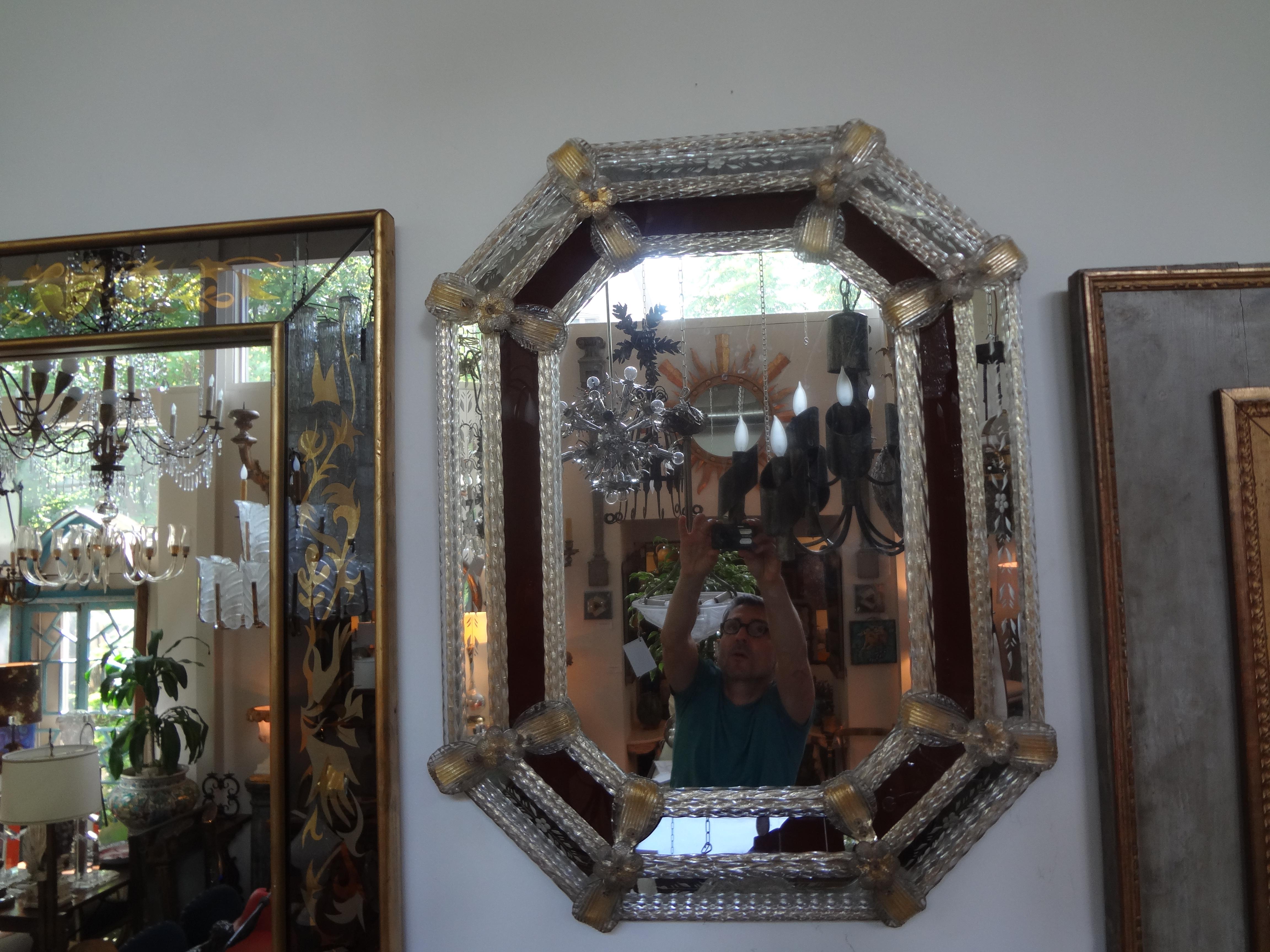 Lovely octagon Venetian mirror with burgundy or maroon and etched glass panels. This Italian Venetian mirror is the perfect size for a powder room or hall.