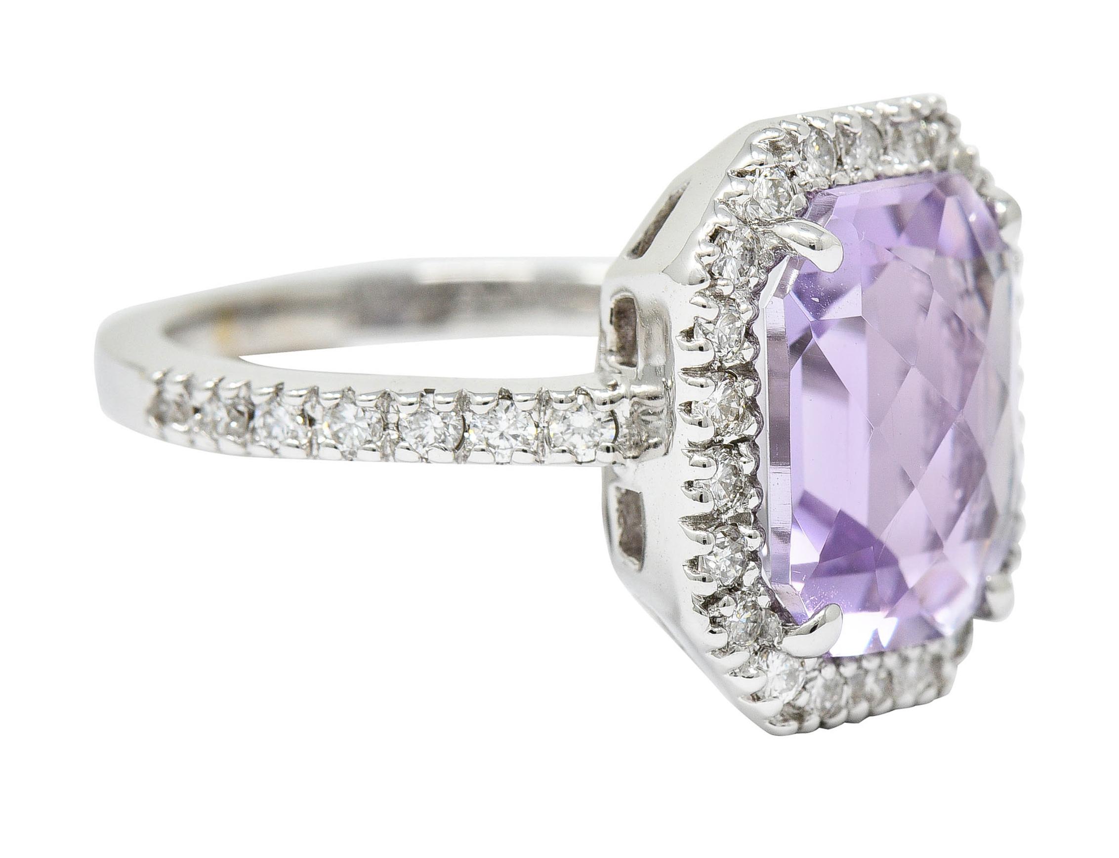 Cluster ring centers a mixed checkerboard octagonal cut amethyst

Transparent with medium light pinkish purple Rose de France color

Surrounded by a diamond halo with accented shoulders

Round brilliant cut diamonds weigh in total approximately 0.75