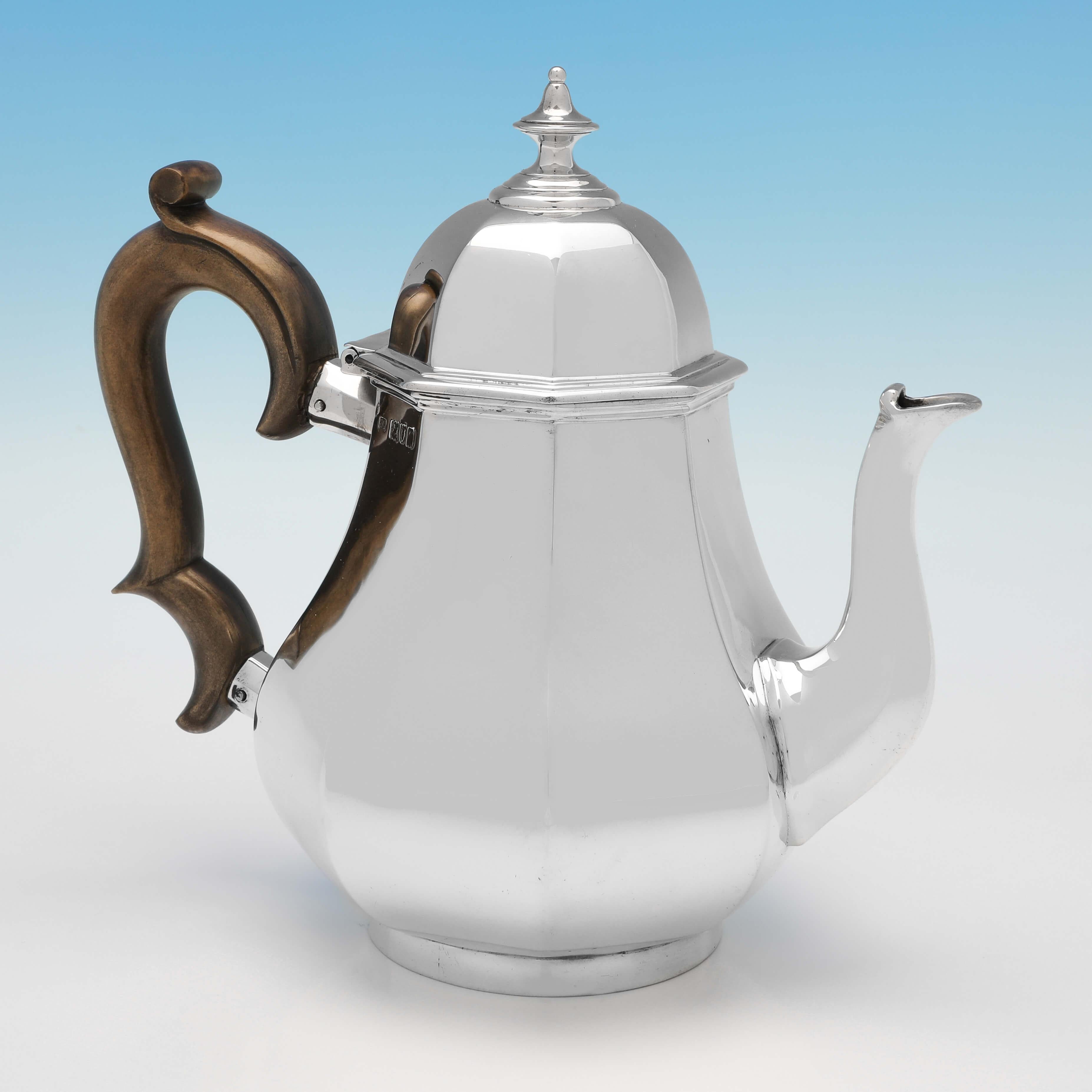 Hallmarked in London in 1911 by Garrard & Co., this handsome, Antique Sterling Silver Teapot, is octagonal in shape and plain in design. The teapot measures 8