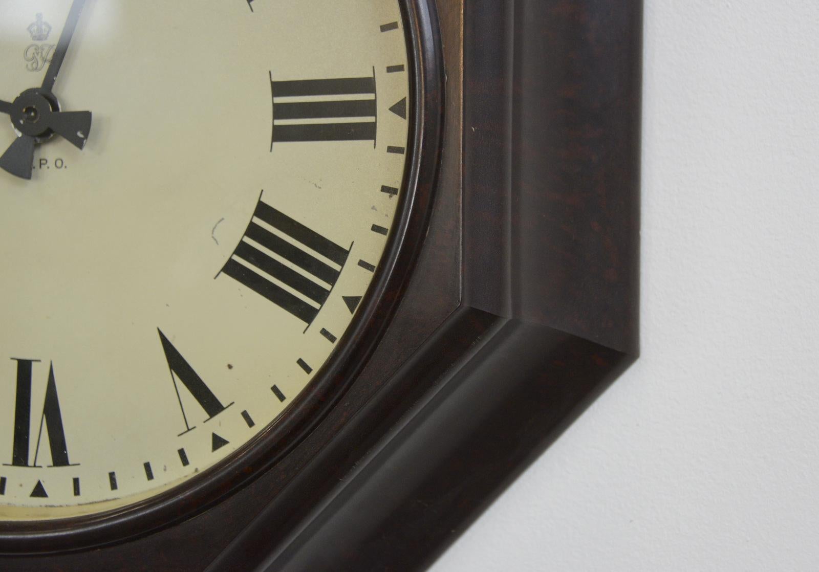 Octagonal Bakelite post office clock, circa 1930s

- Octagonal bakelite case
- Tin dial with Roman numerals
- Marked GPO and with the cypher of King George VI
- Continuous motor
- English ~ 1930s
- 42cm wide x 42cm tall x 10cm