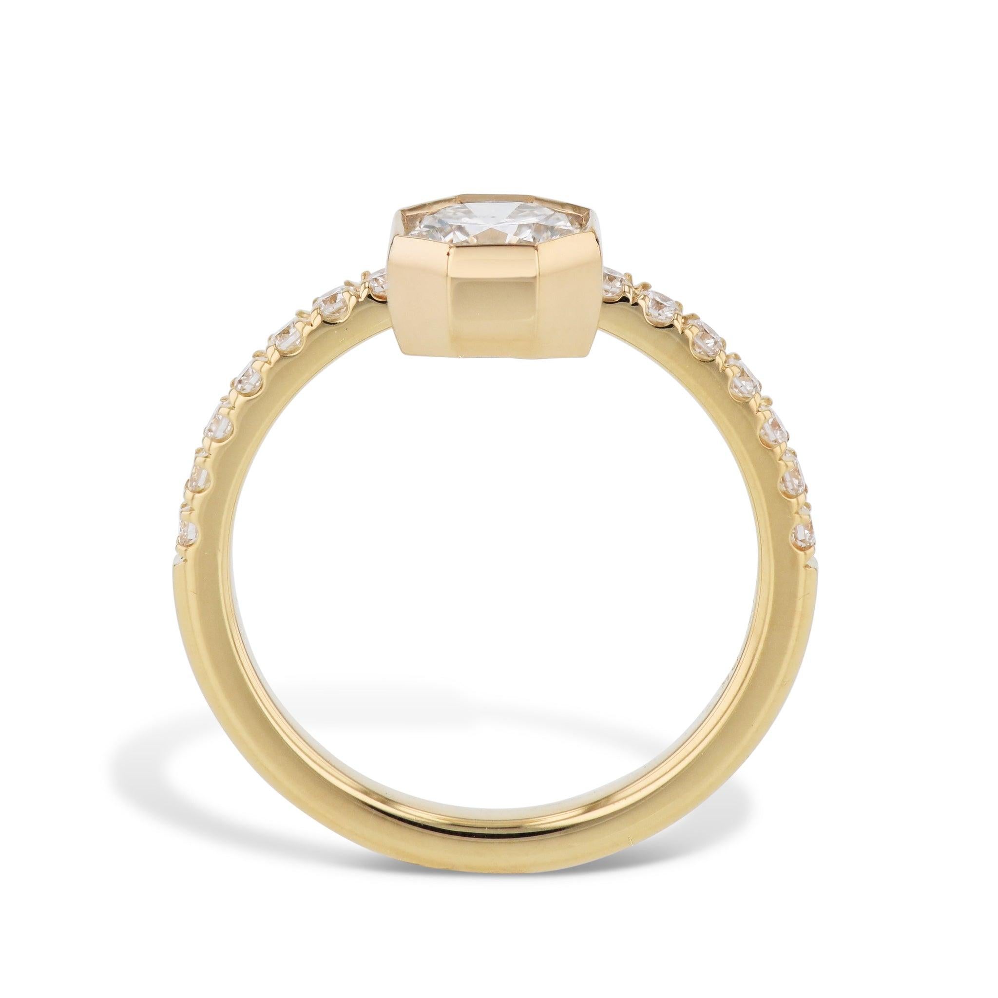 This exquisite Octagonal Bezel Set Diamond Engagement Ring is an exquisite symbol of everlasting love! Handcrafted with 18kt yellow gold, the ring boasts an octagonal diamond and diamond pave. Captivating and timeless, this handmade H&H Collection