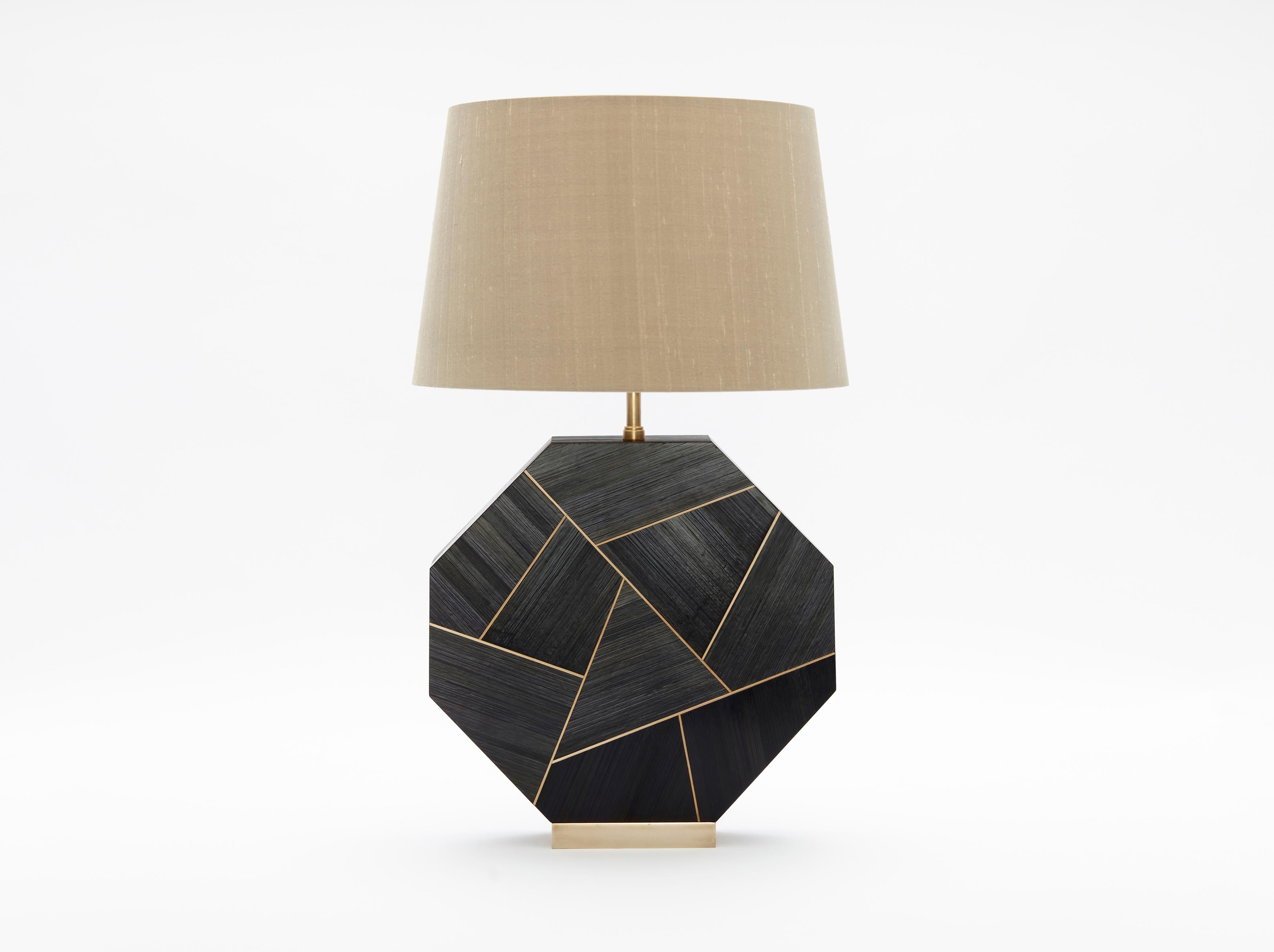 Octagonal Black Straw Marquetry Lamp by Simon Orrell Design
Height (not including lampshade) 32cm Width 30.5 cm Depth 6cm
Finish: Straw Marquetry and brass / Lamp fittings: Bronze
Plug and inline switch: Black or White / Flex: Black, White, Gold,