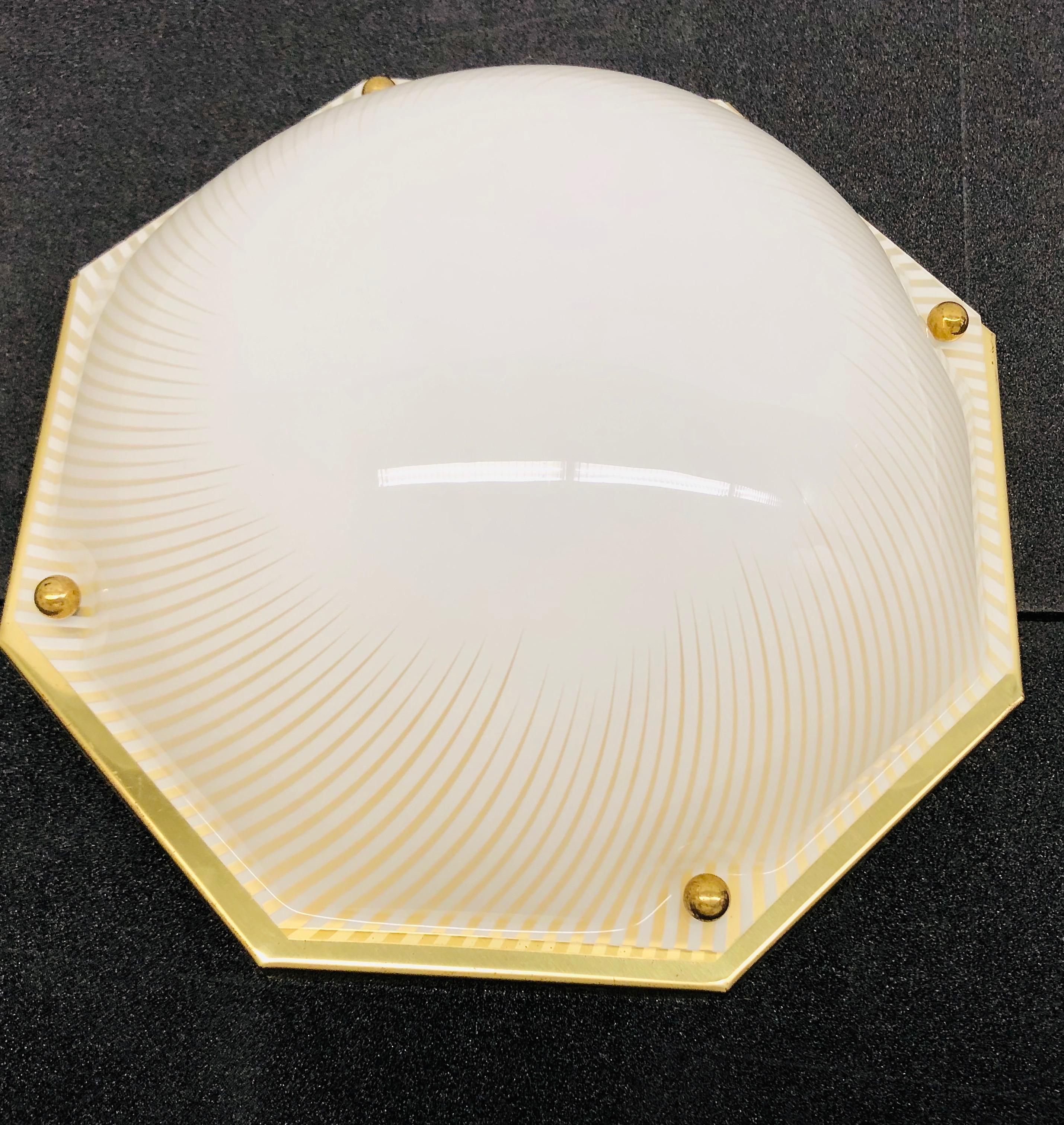 A stunning large Lucite glass flush mount by Zicoli Leuchten, Limbach Germany. It has a nice Lucite glass on a brass frame. The Fixture requires two European E27 / 110 volt Edison bulbs, each bulb up to 60 watts.