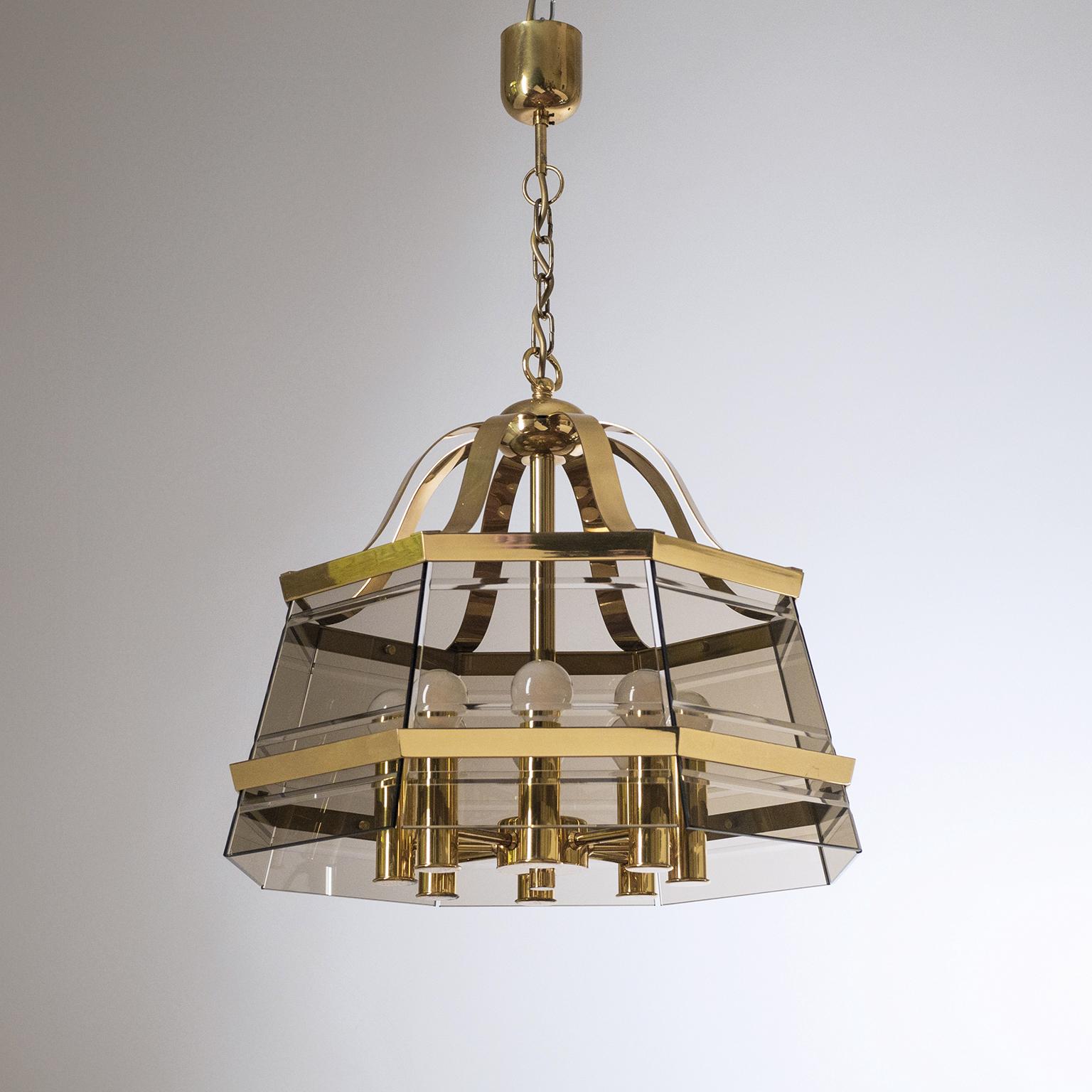 Impressive brass and smoked glass lantern or chandelier from the 1980s. Octagonal brass structure with eight smoked and cut glass planes. Good original condition with minor patina and eight E14 sockets. Height without chain is 17inches/43cm.