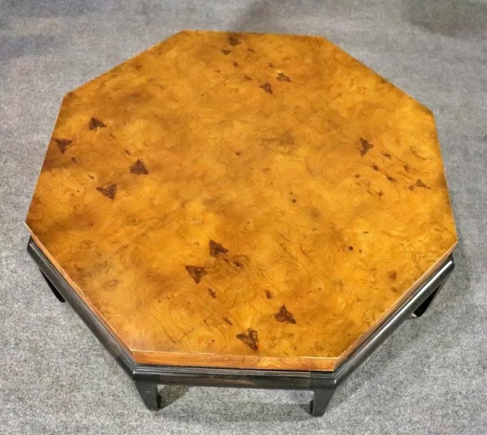 Mid-Century Modern burl wood coffee table black base. Great contrasting color between the gold burl and black base.
Please confirm location NY or NJ.