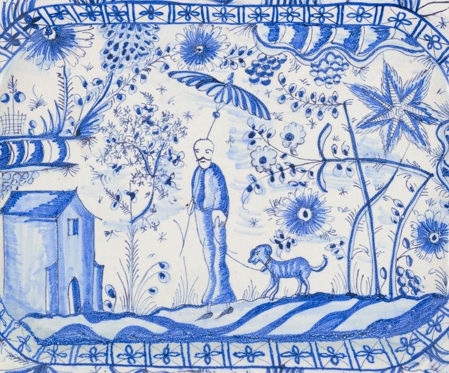20ième siècle Plat octogonal en céramique. Motif peint à la main d'un homme marchant avec son chien. Milieu du 20e siècle. en vente