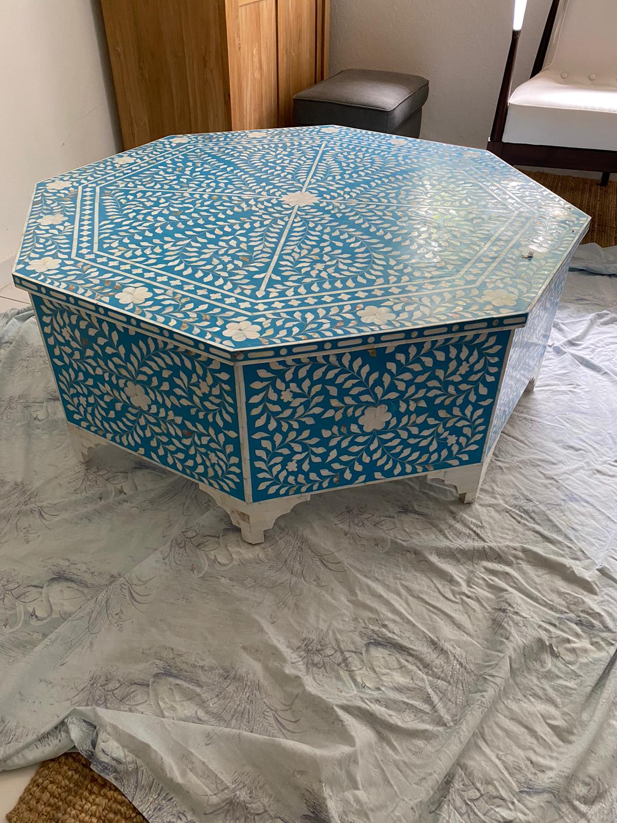 This impressive octagonal-shaped coffee table in mother of pearl comes from Udaipur, India in Rajasthan and will bring a fabulous focal point to your room. Enjoy a sense of calm through its intricate patterned detail and soothing blue color. The