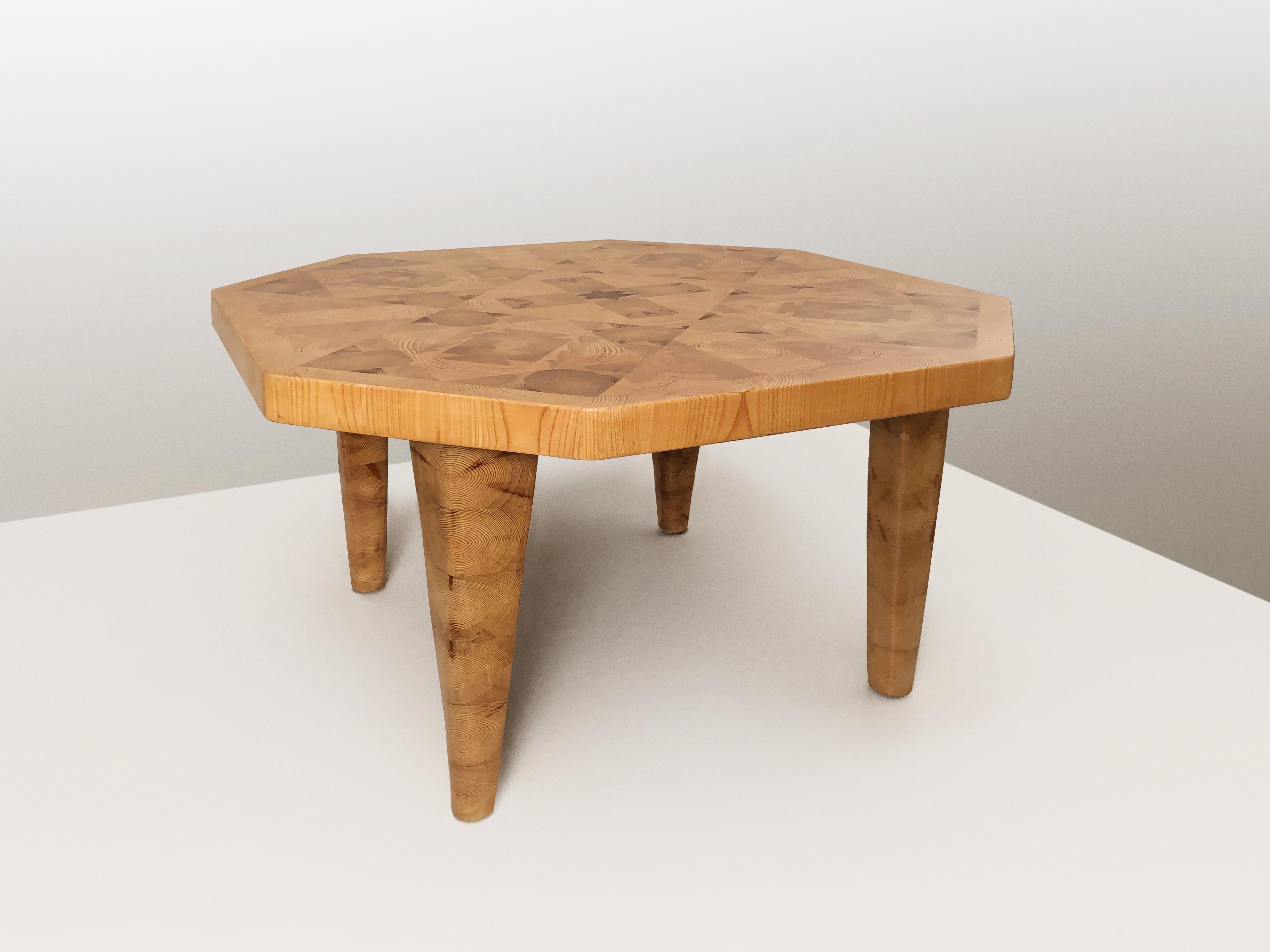 Offered for your consideration is a very rare octagonal coffee table in end grain pine mosaic by Aarre Phojolainen. Table consisting of blocks of solid pine that has been meticulously cut and arranged with the end grain cut facing upwards forming an
