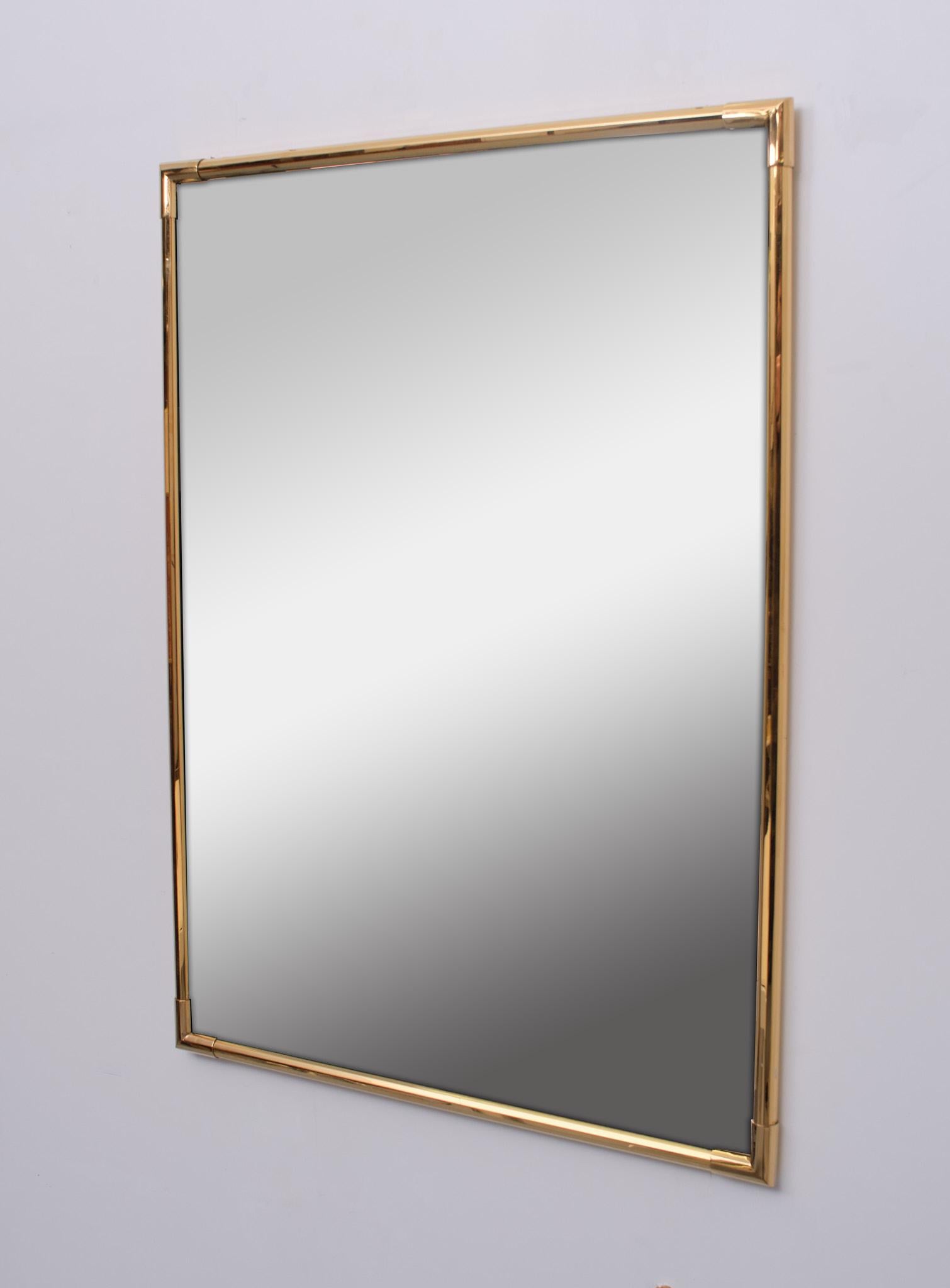 Octagonal Gold plated Brass frame. Thick new mirror. Very nice quality Mirror. 1970s Belgium .
 