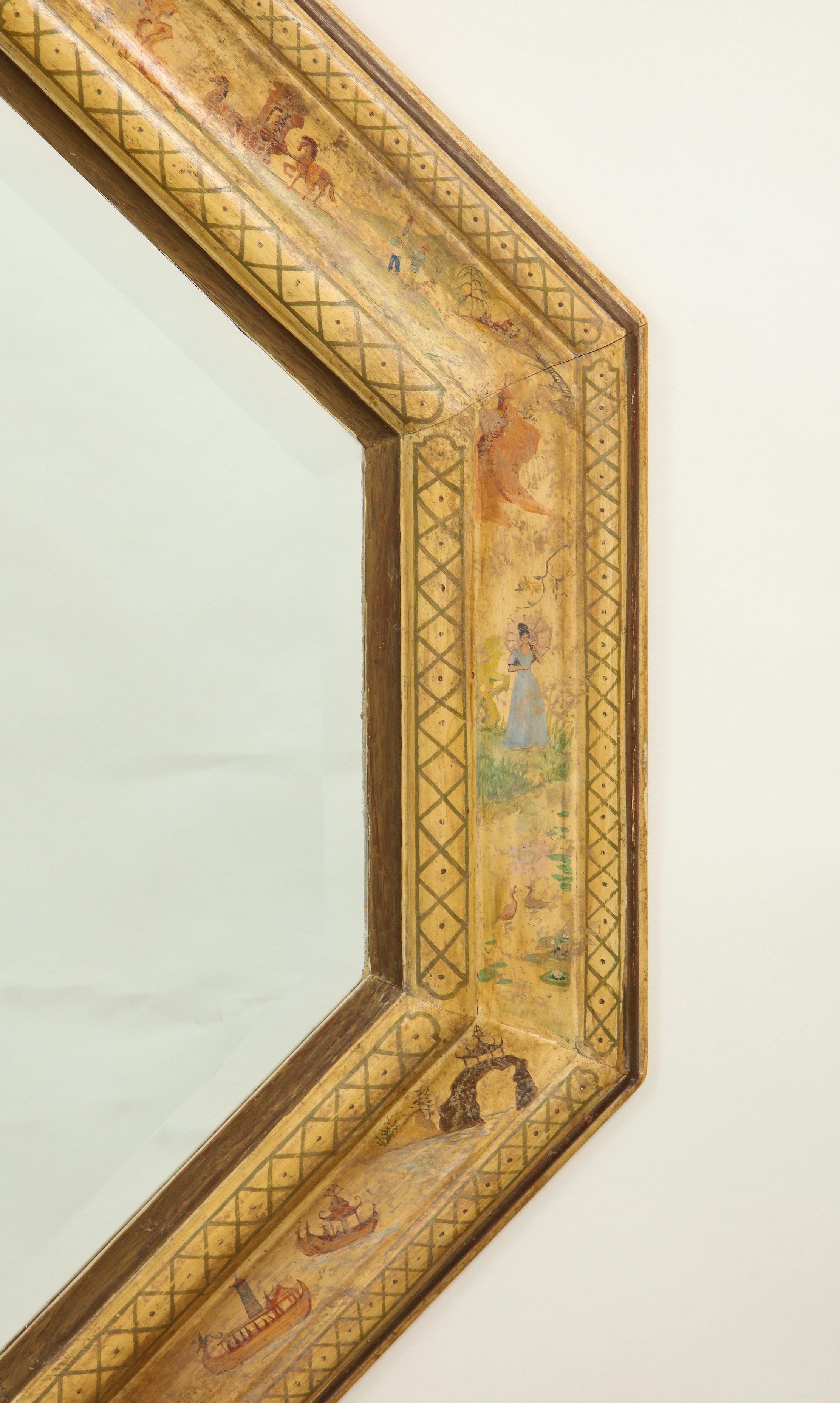 The octagonal mirrored plate within a gilt slip and cushion frame charmingly hand painted with scenes of European figures in pastoral settings on a parchment-colored ground.