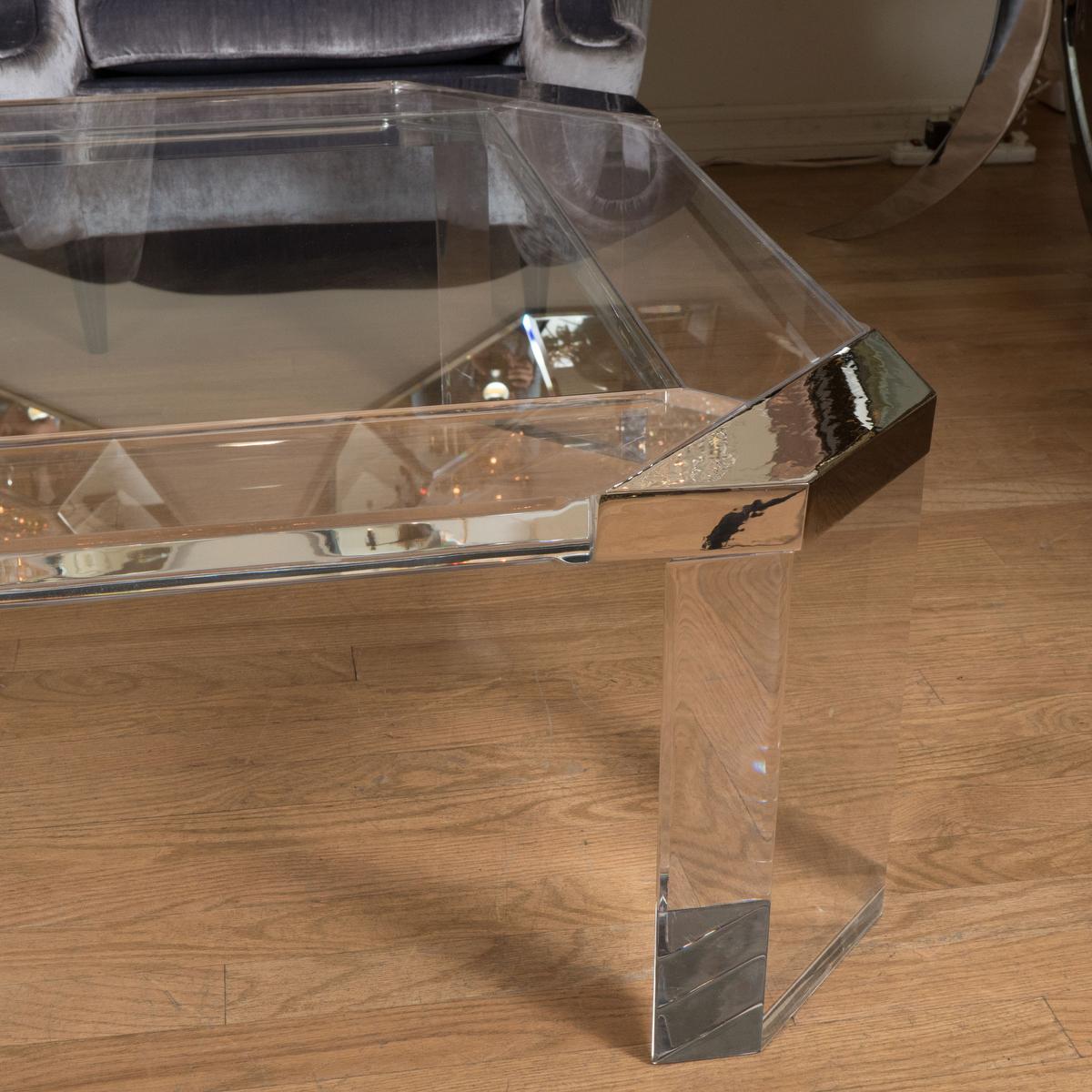 Octagonal lucite coffee table with glass top and chrome details attributed to Karl Springer. 