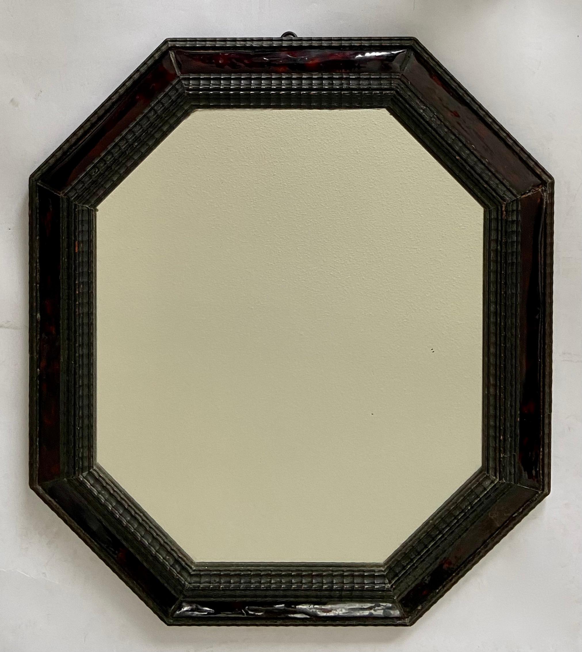 Octagonal mirror in ebonished frame with tortoise shell, Dutch, 19th Century.