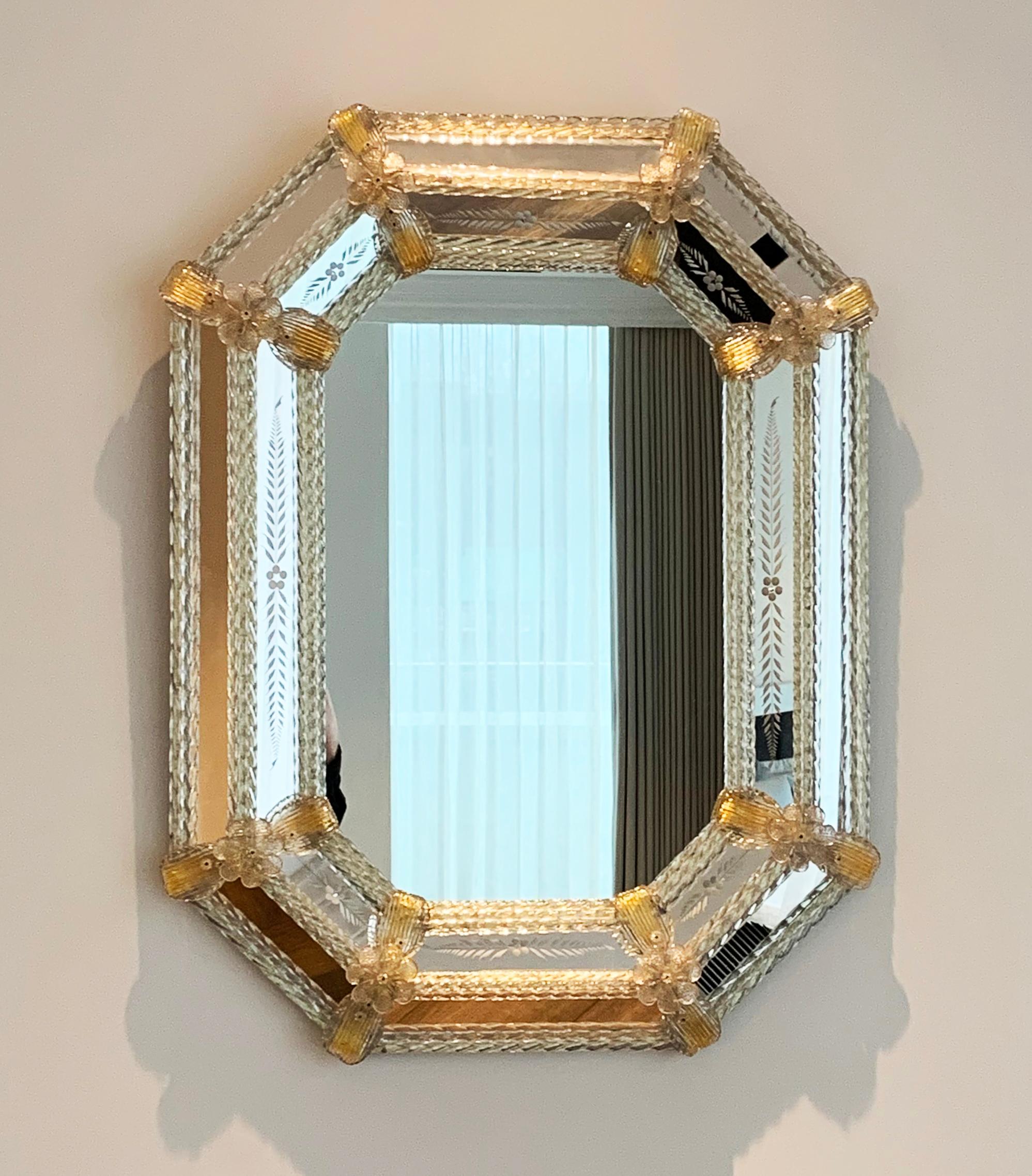Octagonal Venetian Mirror Gold Leaf Murano Glass 

A true work of art. This octagonal mirror is adorned with the finest hand crafted Murano glass, a piece that exemplifies the skill and craftsmanship from the world renowned makers of Murano.

Taking