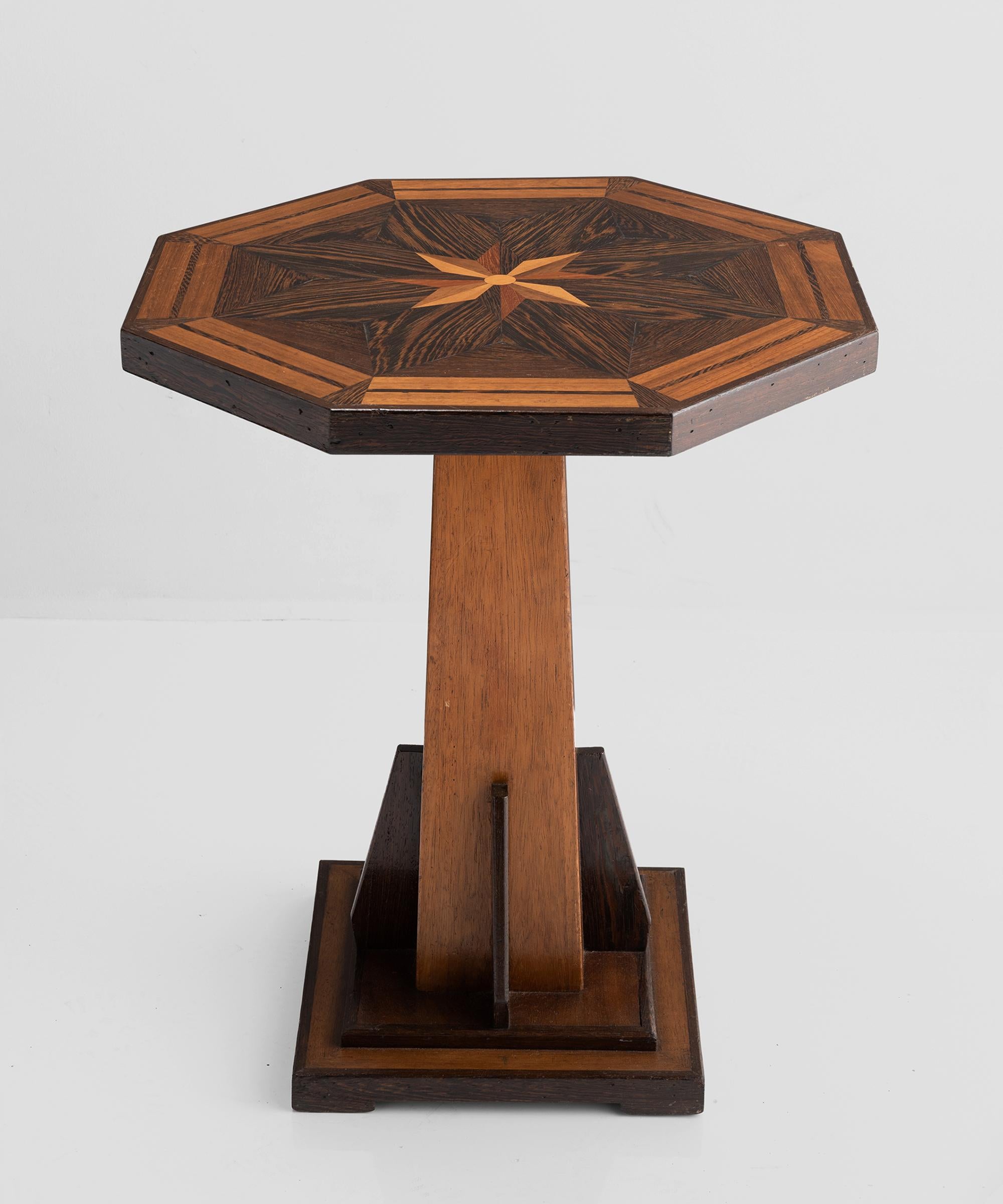 Octagonal occasional table, England, circa 1870.

Specimen wood veneered top on pedestal base.