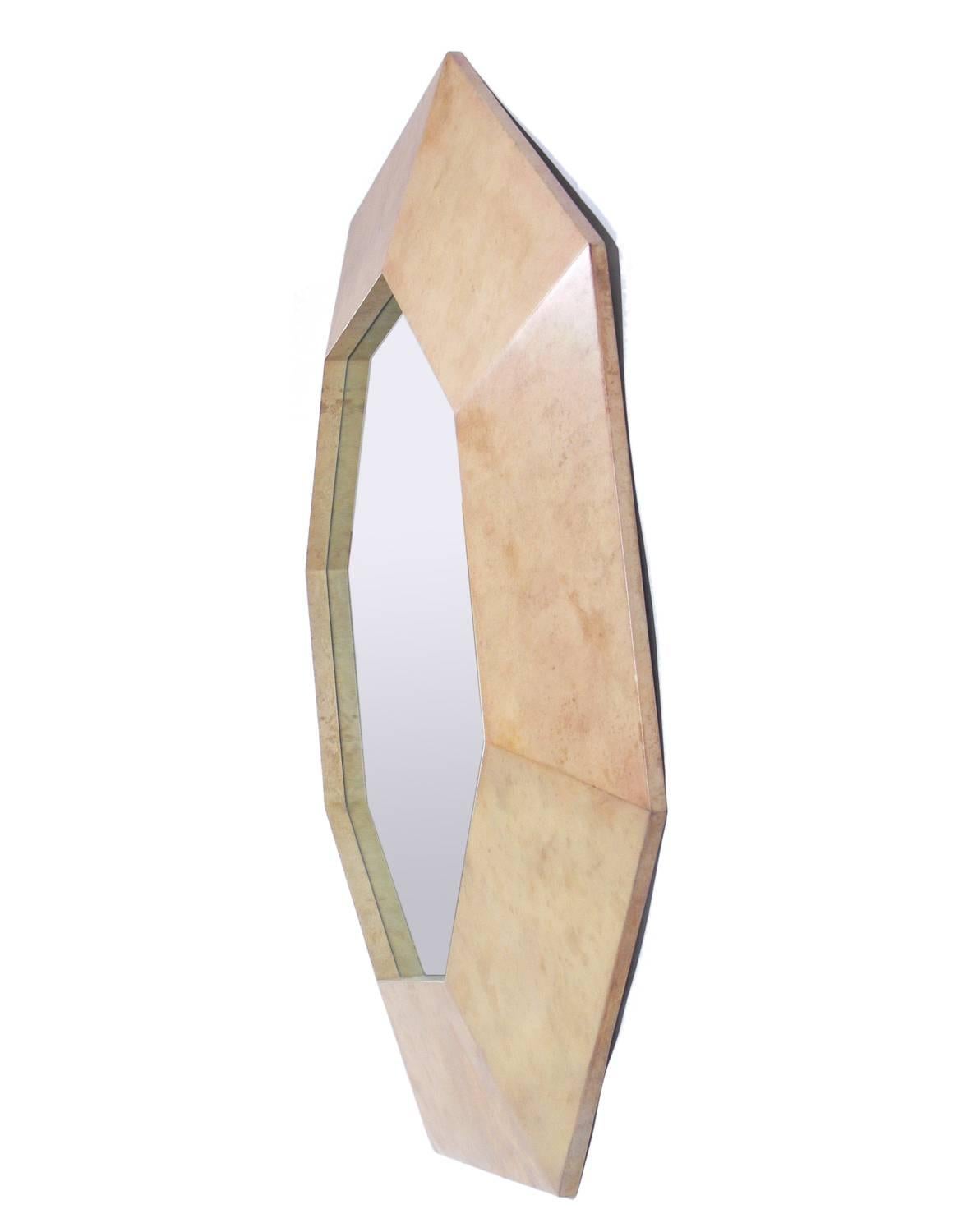 Octagonal parchment mirror, in the manner of Karl Springer, American, circa 1970s. Retains warm original patina.