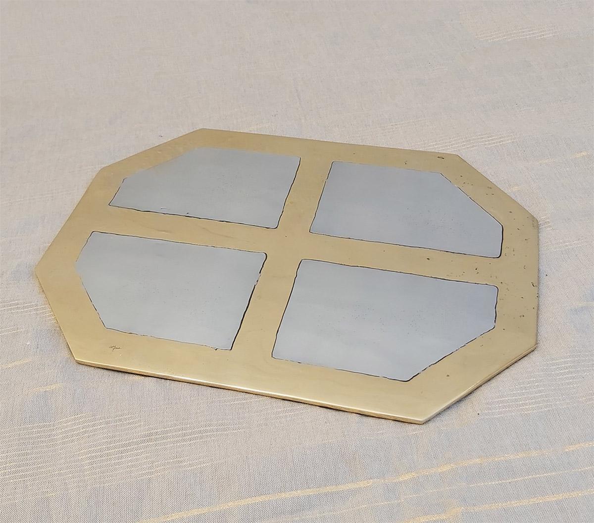 The decorative Place Mat was created by David Marshall, it is made of sand cast aluminum and sand cast brass. 
We can engrave this piece with your Initials or Logo, makes a beautiful Wedding or Company Gift.
Handmade, mounted and finished in our