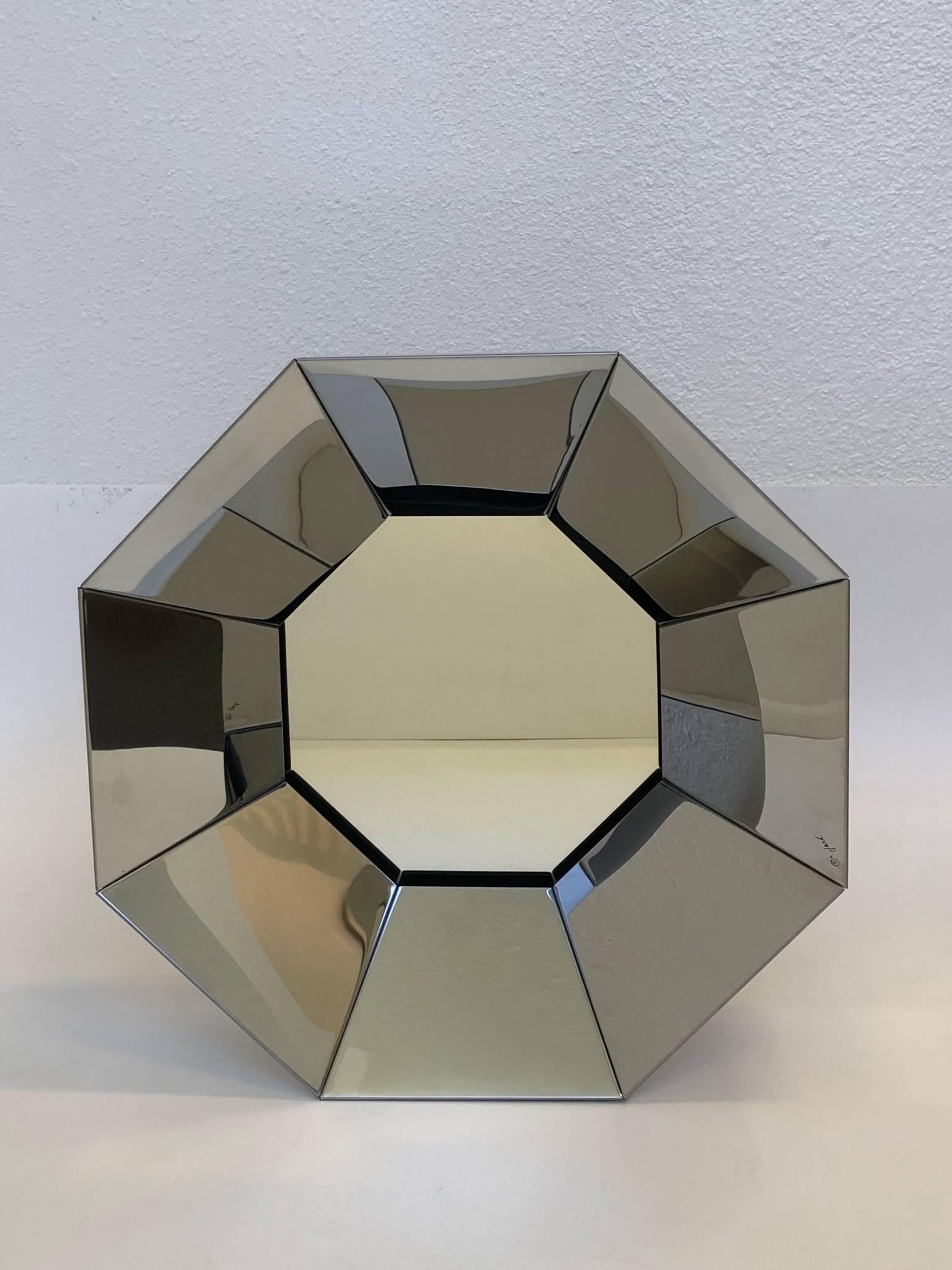 A beautiful 1970s hexagonal shape chrome mirror by Curtis Jere. The mirror is signed.
Dimension: 16” high, 16” wide and 5” deep.
   