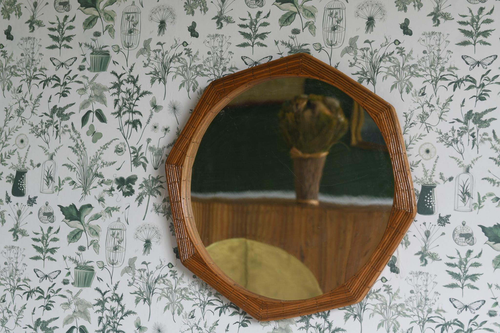 This unique octagonal shape wall mounted mirror, framed with high-quality pencil reed material, adds a touch of midcentury style to any room. Perfect for bathrooms, hallways, and bedrooms, this mirror is a statement piece that will elevate yfor any