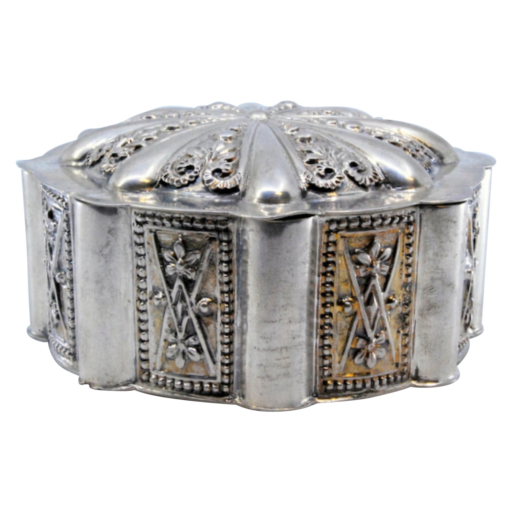 Octagonal silver jewelry box with geometric motifs on the removable lid