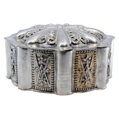 Octagonal silver jewelry box with geometric motifs on the removable lid
