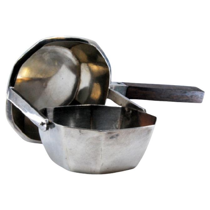 Octagonal silver tea strainer with chestnut wood handle