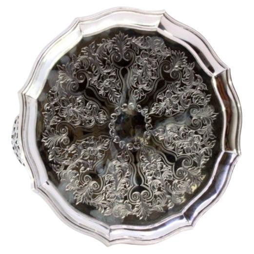 Octagonal silver tray w/ plant engravings 
3 cut-out feet For Sale