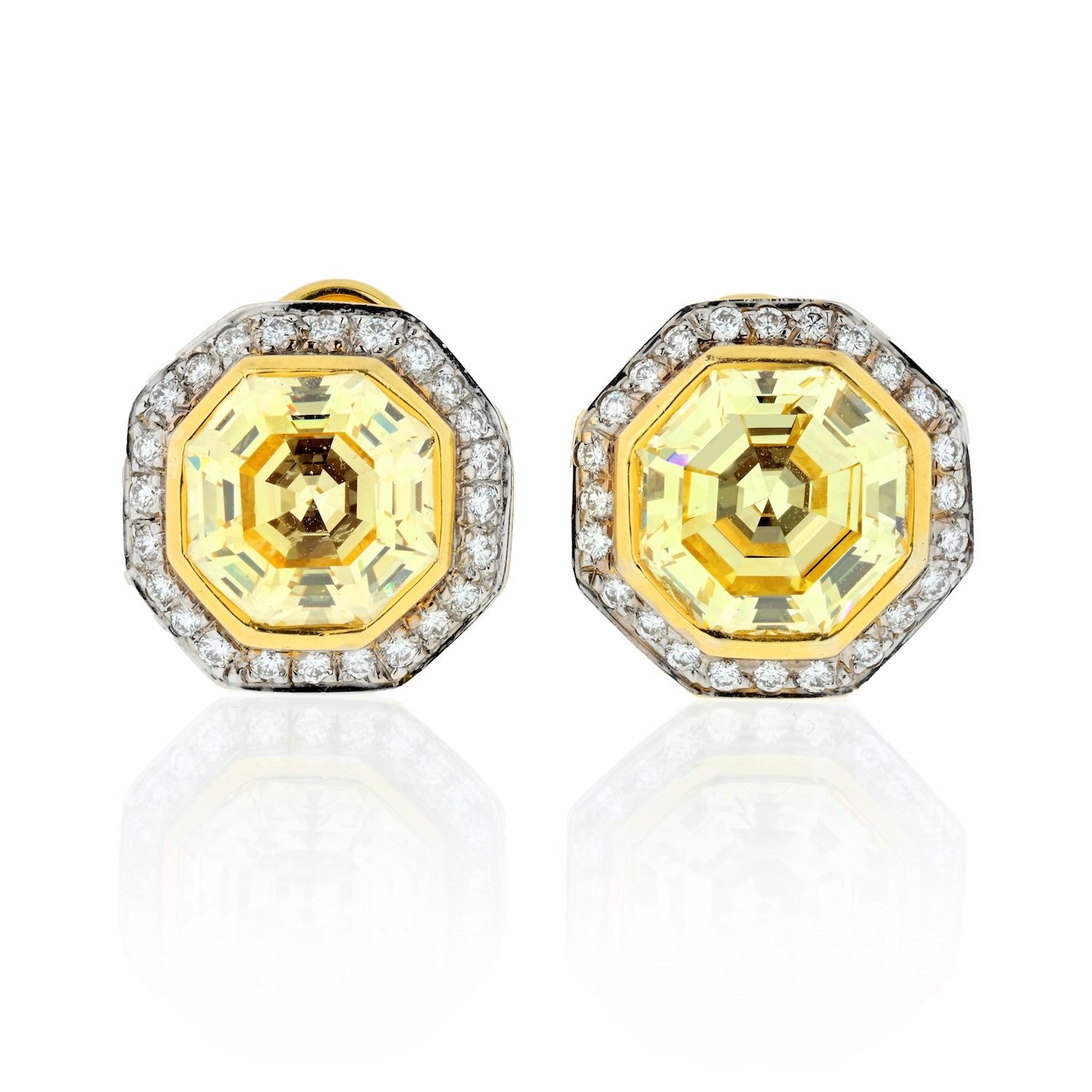 An absolutely exquisite pair of Fancy Yellow GIA certified diamond stud earrings. This gorgeous pair of earrings is made of 18K yellow gold and features very unusual Octagonal Step Cut diamonds at its center.  Octagonal step cut diamonds, that's