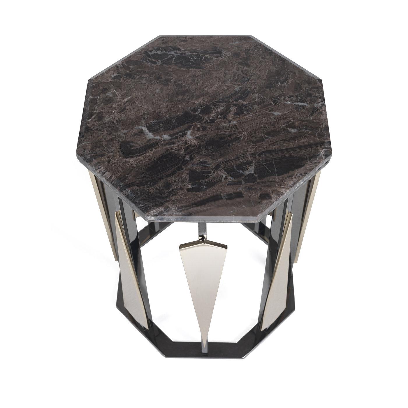 An exercise in creativity and innovative aesthetic sensibility, this sophisticated side table is a dynamic and exceptional work of functional decor. The hexagonal Cappuccino marble top is supported by a brass open frame in a black nickel finish. The