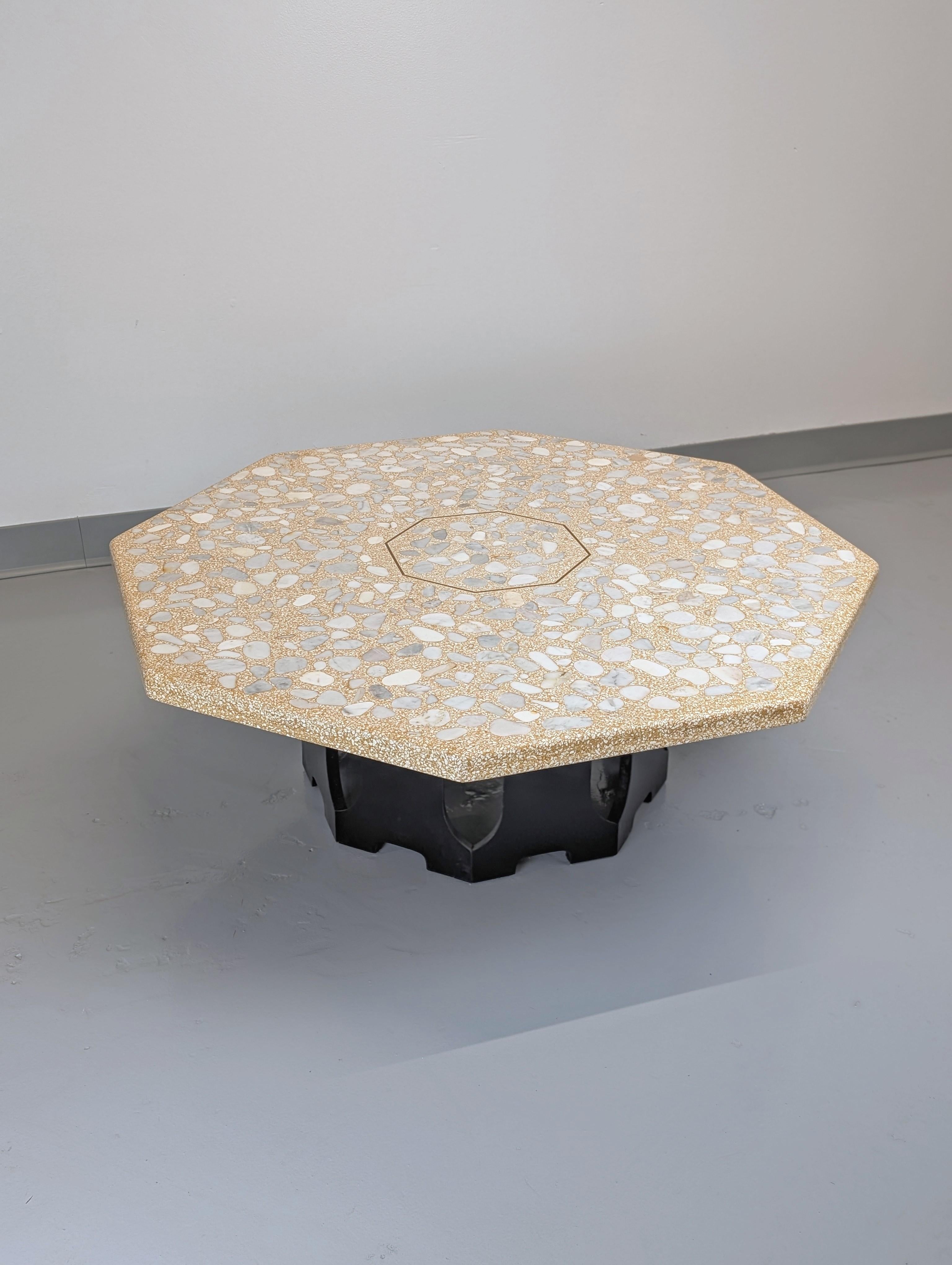 Large coffee table by Harvey Probber. Ebonized  wooden base with travertine and marble top with a octagonal brass centered inlay. 