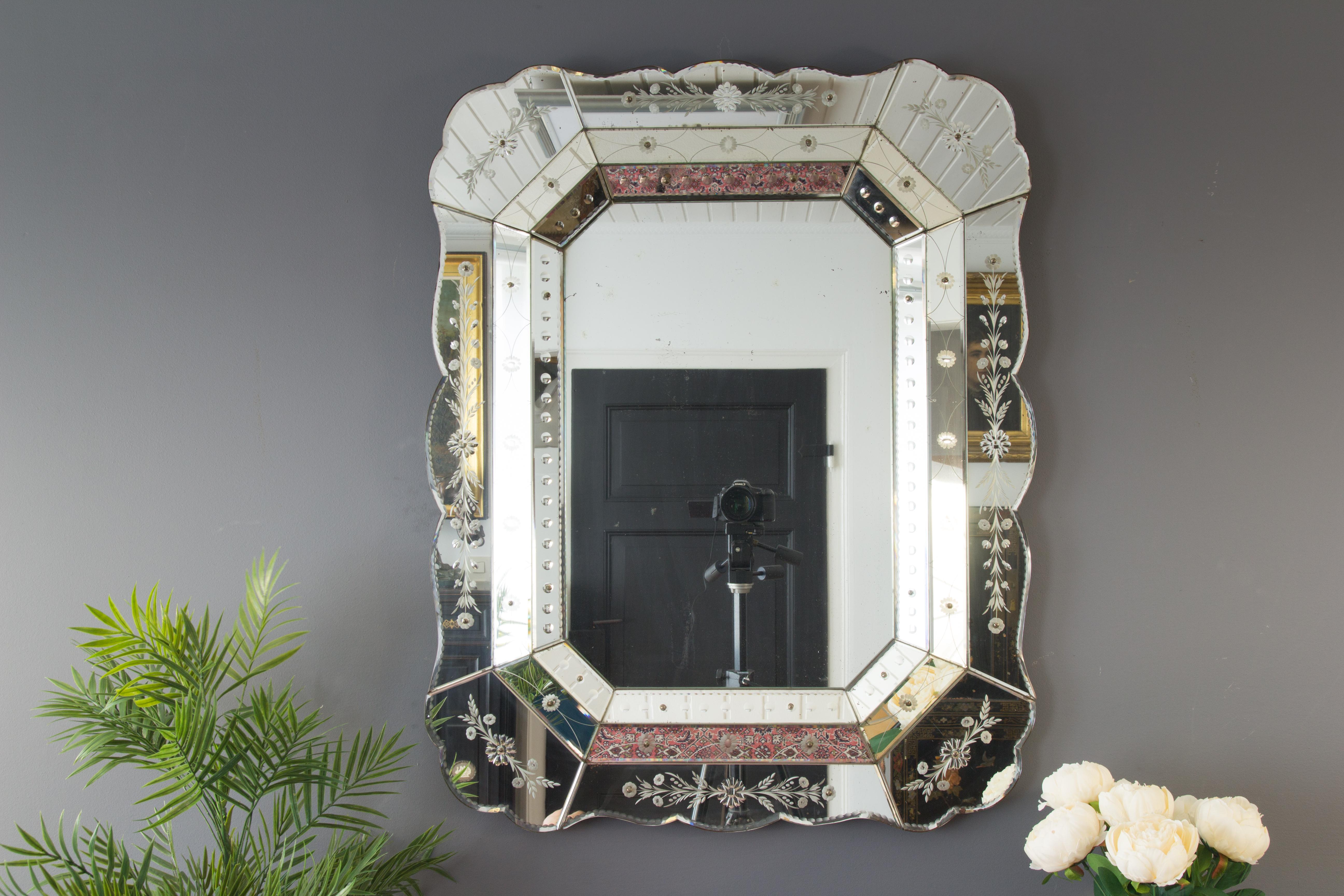 Beautiful Venetian octagonal wall mirror, richly decorated with floral reverse-etching. With some wonderful patina, minor loss to silvering.
Dimensions: Height 95 cm, 37.4 in; width 75 cm, 29.52 in; depth 5 cm, 1.96 in.
   