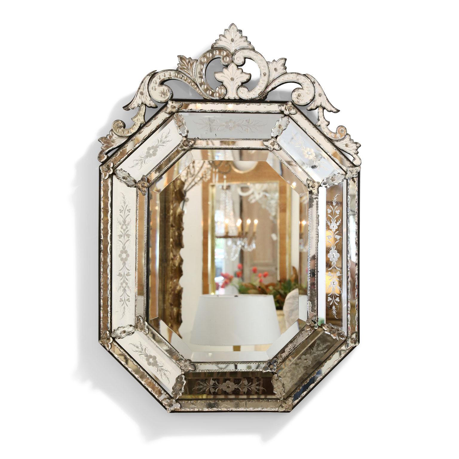 Octagonal Venetian mirror, (circa 1870-1880). Topped by elaborate openwork crest. Very good condition with only minor losses to its silvered mirror backing.