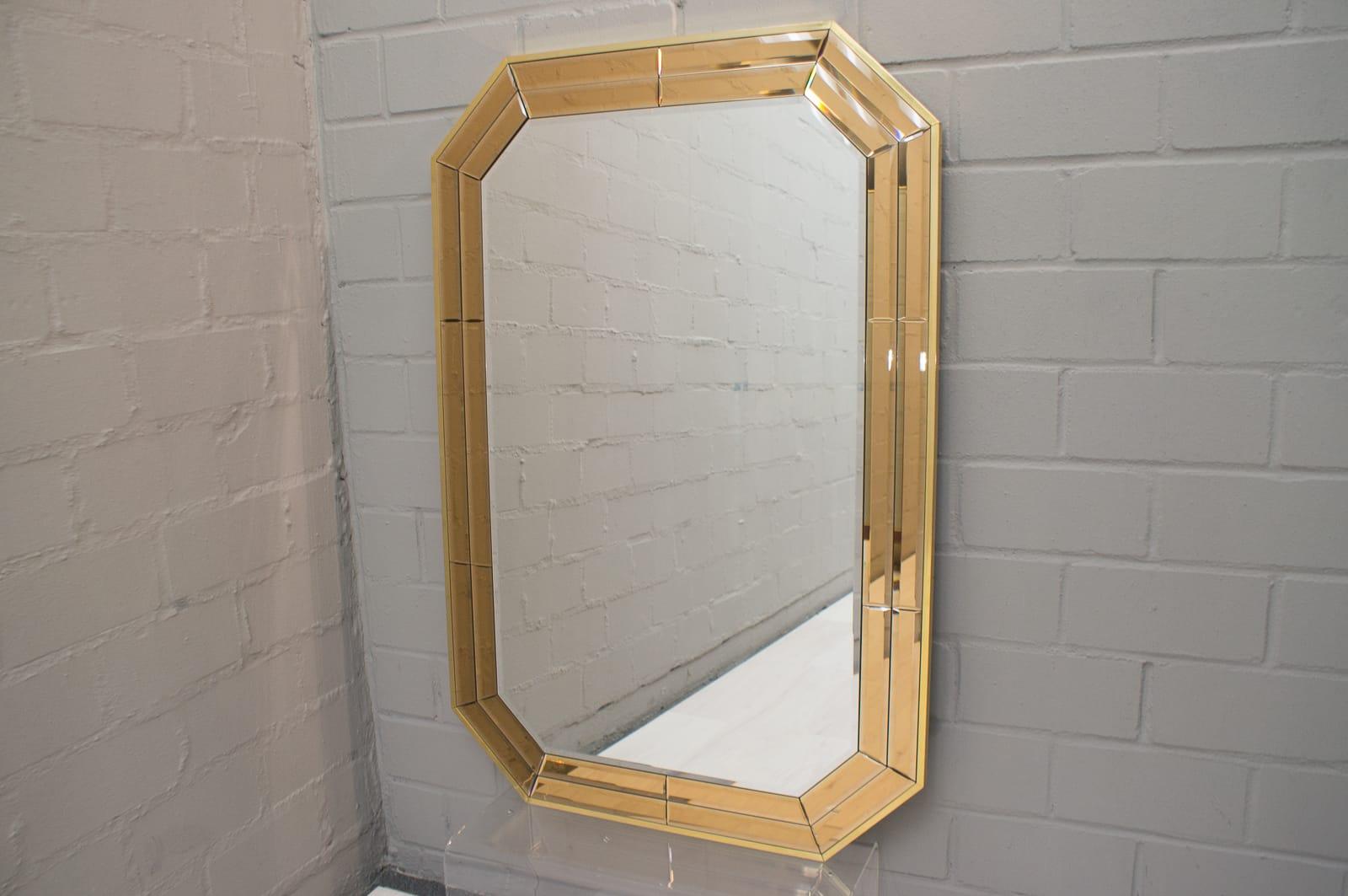 Massive and large wall mirror with faceted stained glass in brass frame. Manufactured by Schönninger, Germany. Very high quality work, 1960s. Can be hung upright and crosswise.