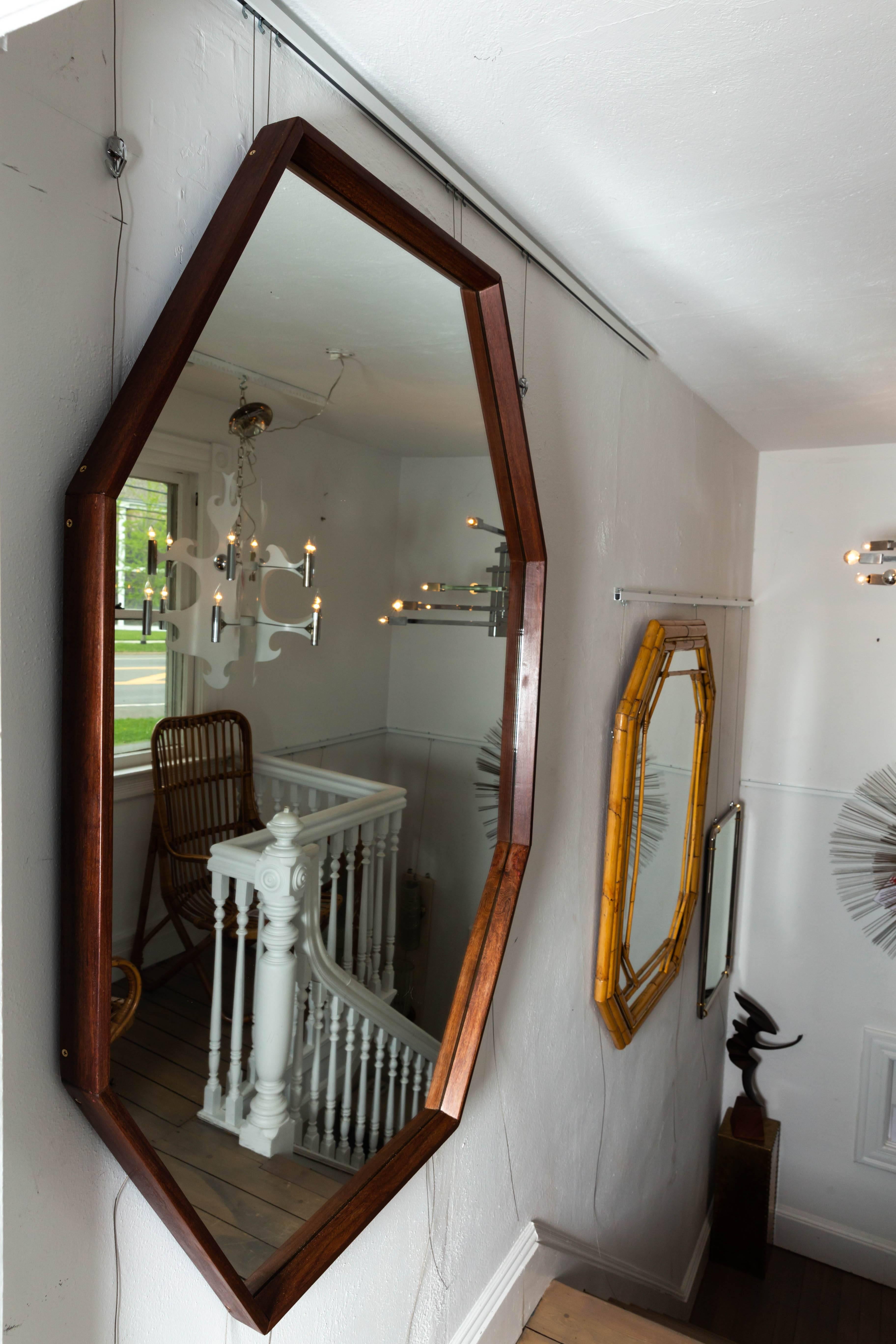 Octagonal walnut surround mirror.