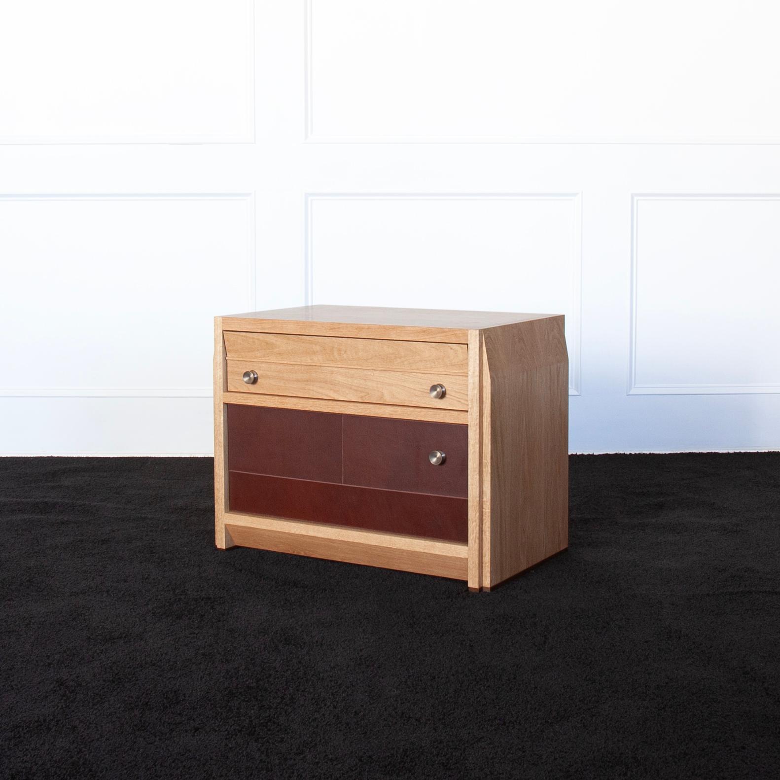 Octavia Nightstand by Crump & Kwash 

Features a solid wood case / oiled or acrylic finish / patinated solid brass pulls / premium, full extension, soft close drawer slides / solid maple, dovetailed drawer box / veg tan leather door