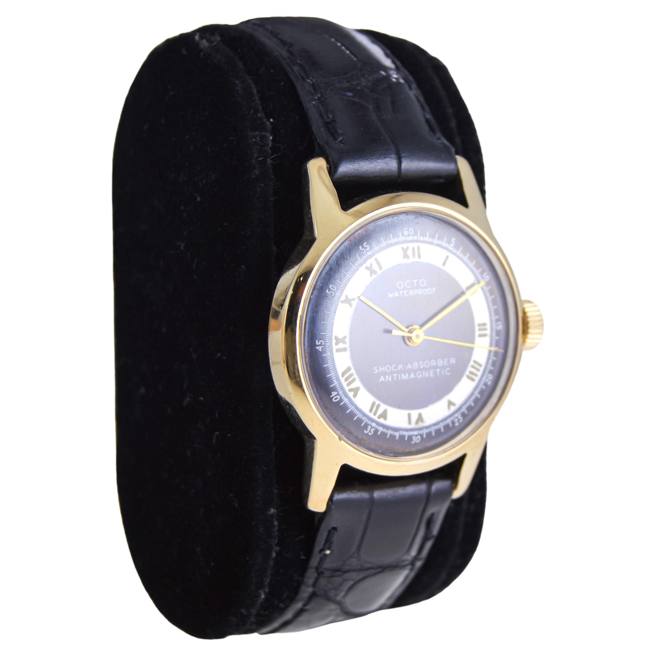 FACTORY / HOUSE: Octo Watch Company 
STYLE / REFERENCE: Round 
METAL / MATERIAL: 14Kt. Solid Gold 
CIRCA / YEAR: 1950's
DIMENSIONS / SIZE:  Length X Diameter
MOVEMENT / CALIBER: Manual Winding / Jewels 
DIAL / HANDS: Original Two Tone Charcoal and
