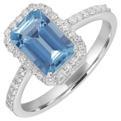 Anello a fascia con acquamarina a forma di ottagono e diamanti in oro bianco 18 carati