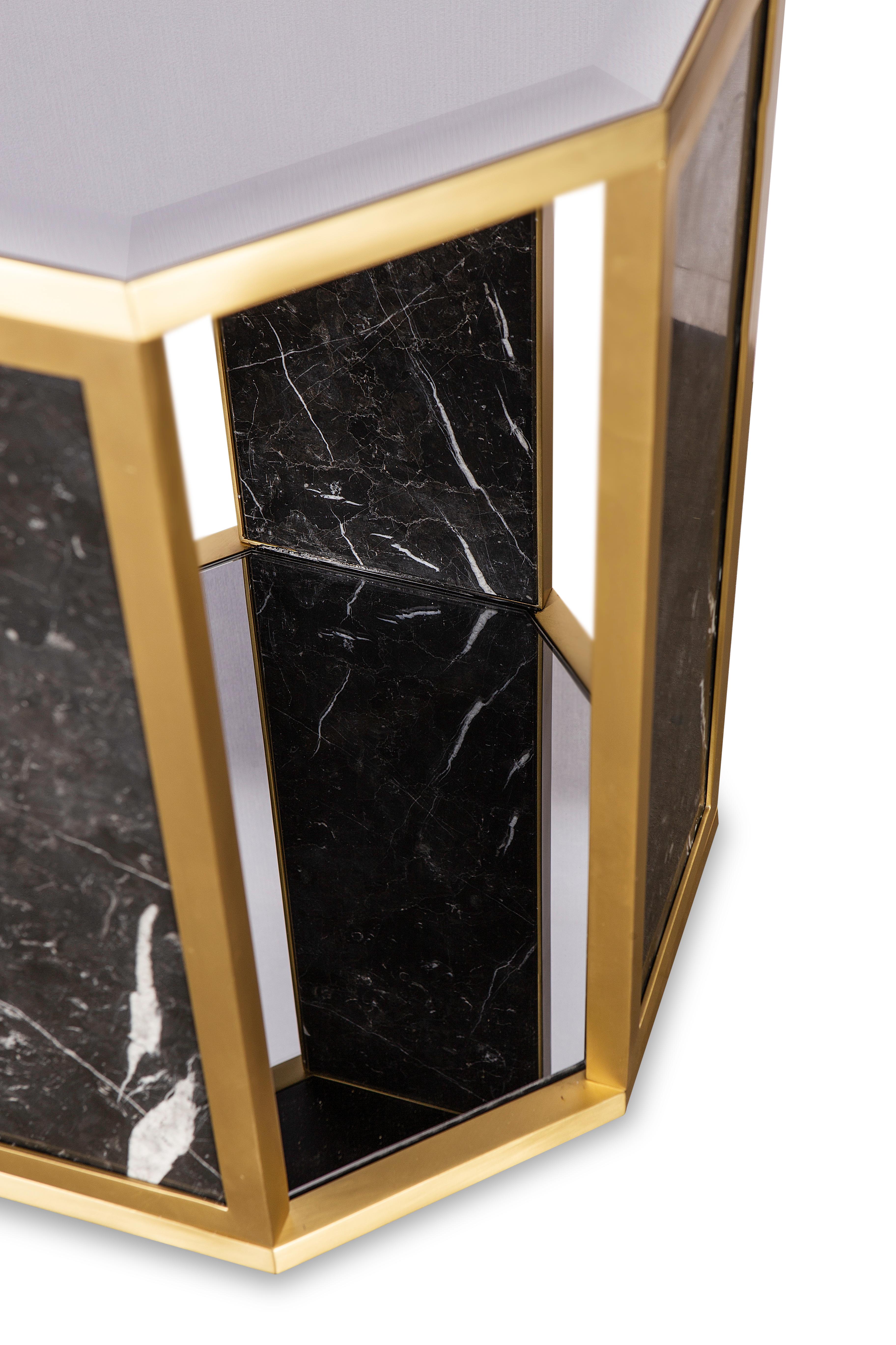 Octogon Side Table by Memoir Essence
Dimensions: D 46 x W 46 x H 54,5 cm.
Materials: Brushed brass, Nero Marquina marble and gris mirror.

Also available in polished brass. Please contact us.

Octogon side table presents a geometrical shape, this