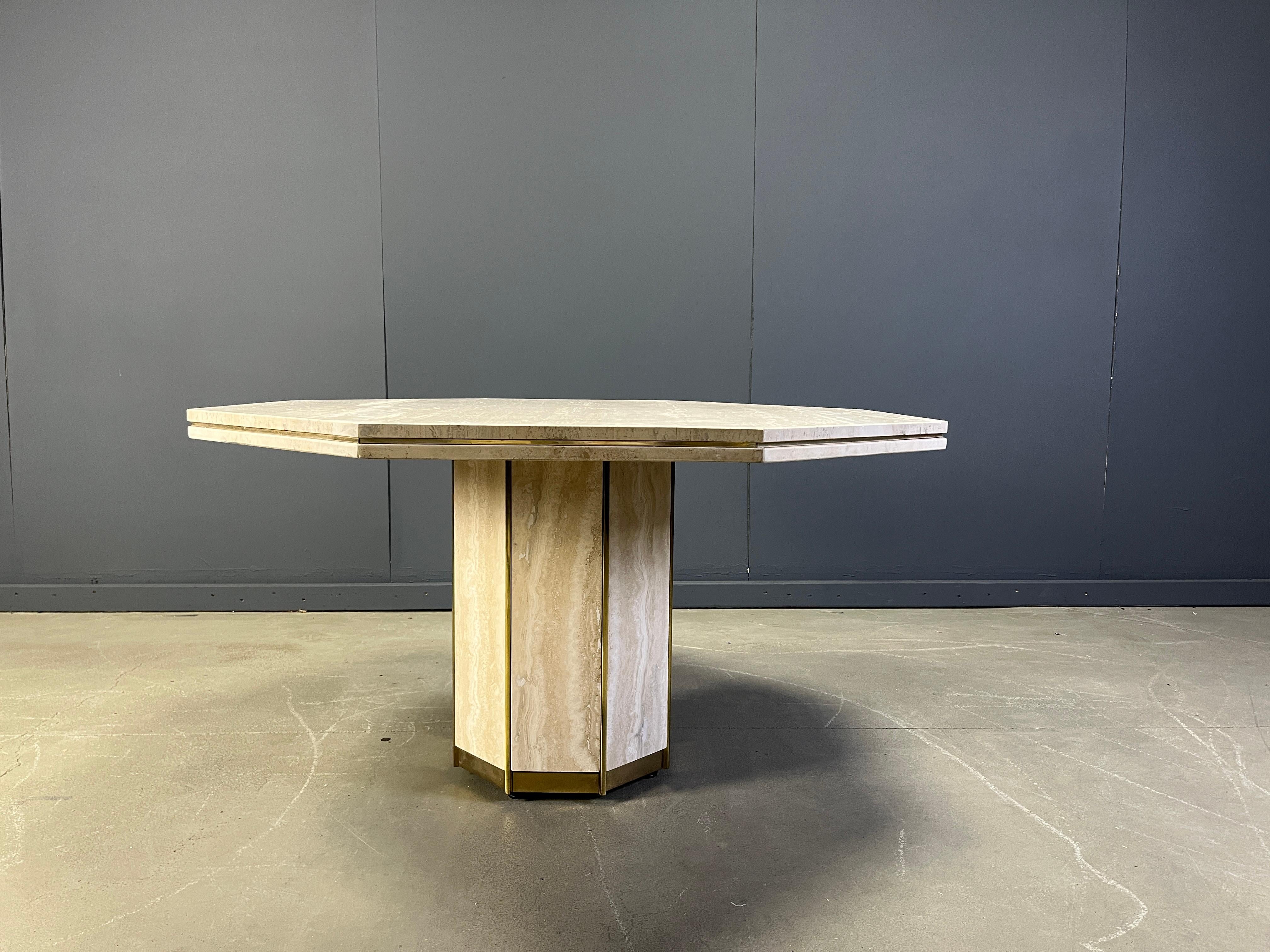 
This table effortlessly combines the timeless beauty of natural stone with the luxurious touch of brass accents, creating a centerpiece that is both functional and artistically captivating. Its unique octagonal shape offers a sophisticated twist on