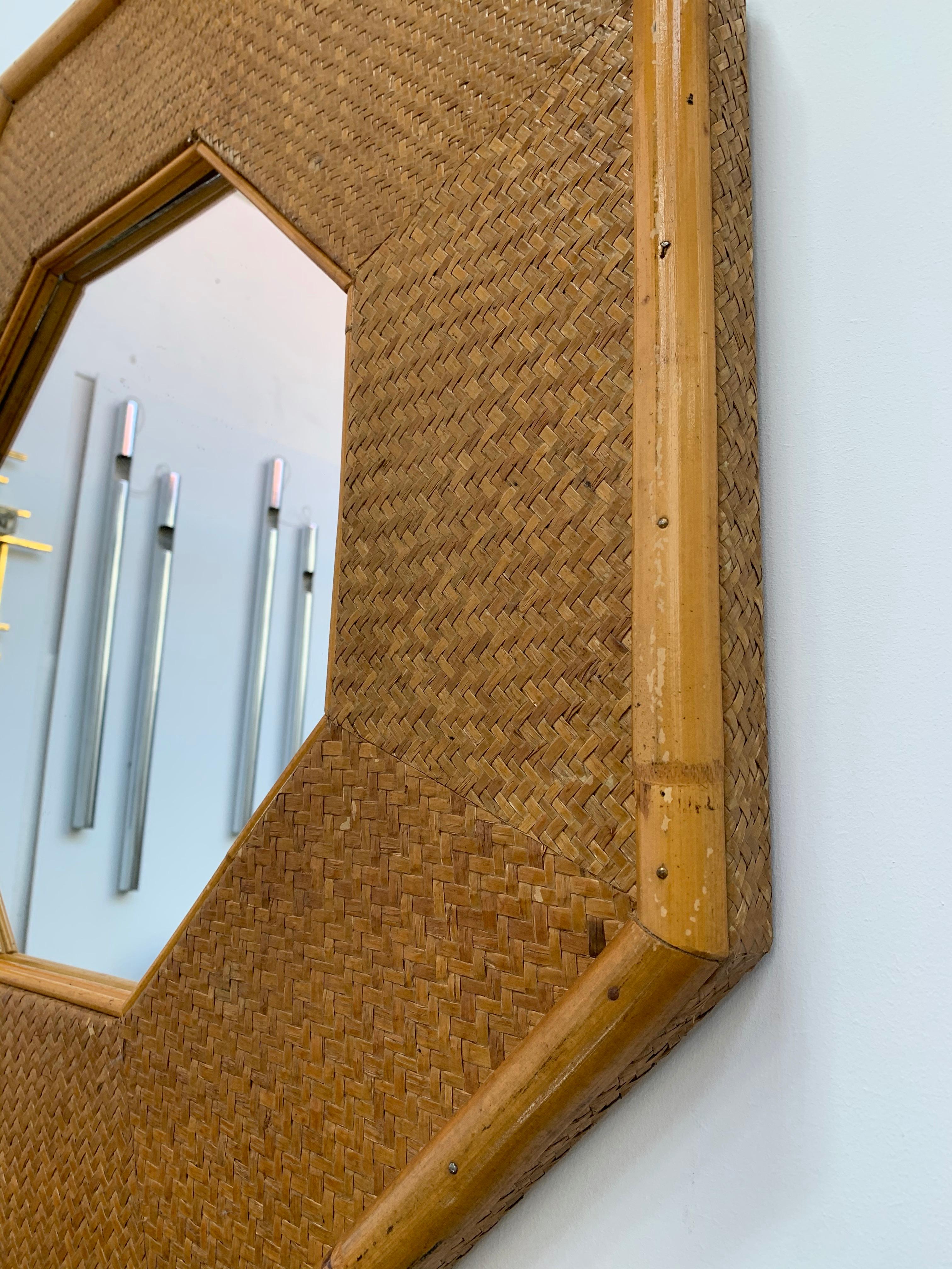 Octagonal rattan bamboo mirror. In the style of Maison et Jardin, Jansen, Willy Rizzo, Romeo Rega.