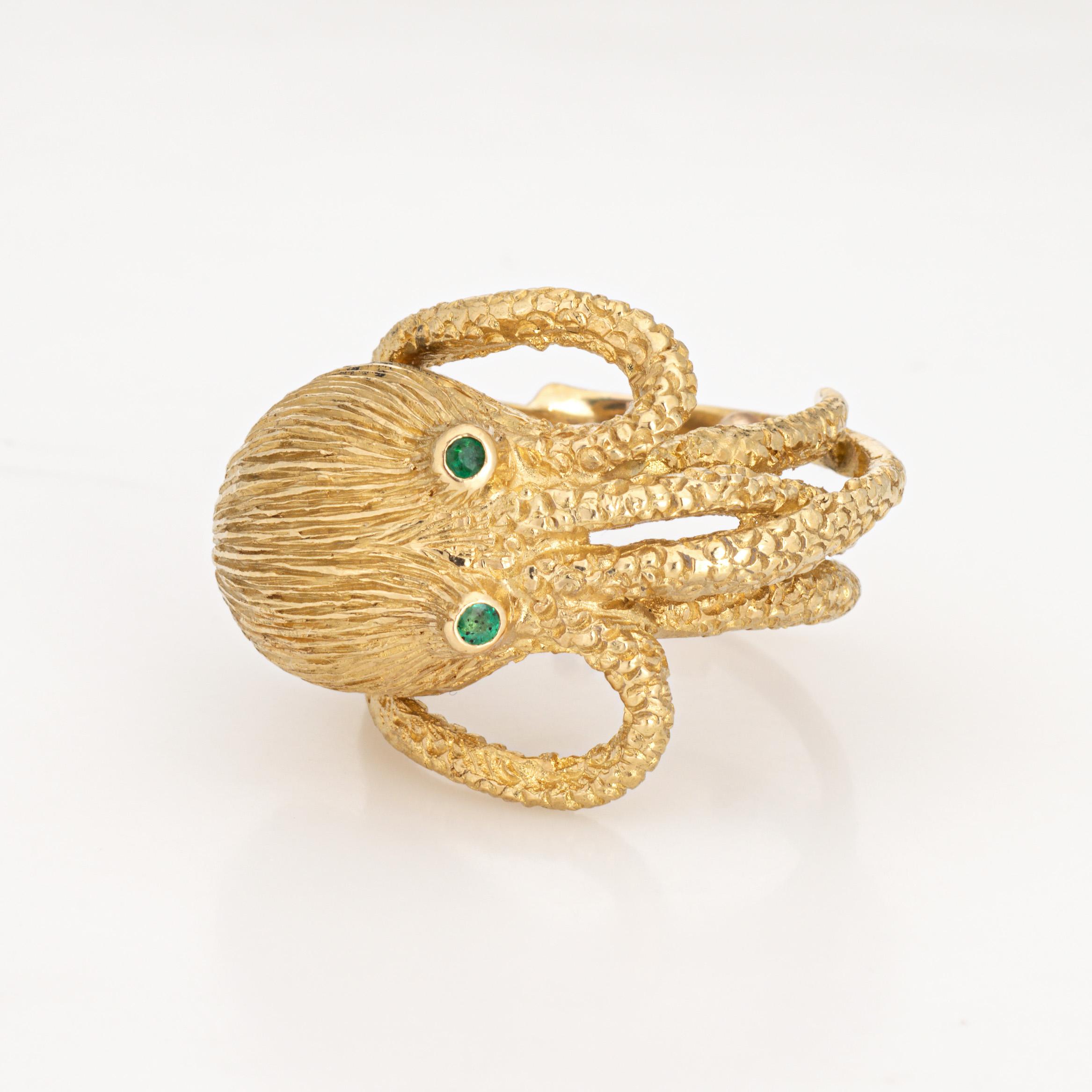 Distinct & beautifully detailed Octopus ring crafted in 18 karat yellow gold (circa 1980s). 

Two small emeralds total an estimated 0.02 carats.  

The elaborate Octopus is a unique conversation starter! Meticulously crafted in 18k yellow gold