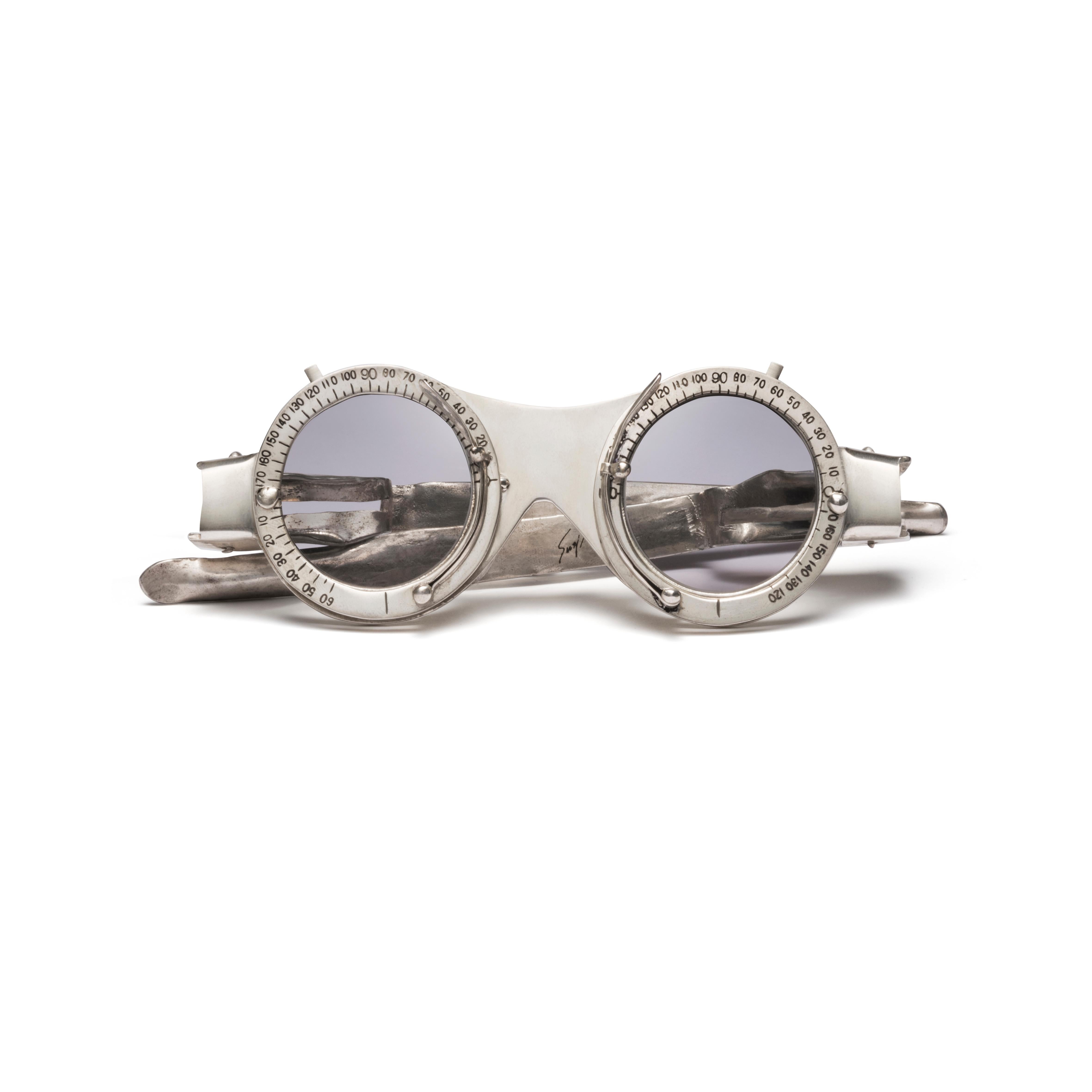 One sterling silver eyeglasses, seven pairs of interchangeable tinted lenses, one Lacquer box with platinum foil

Produced by Lizworks and Selima Optique.

“Oculist Witness” is comprised of a pair of sterling silver frames with a palette of