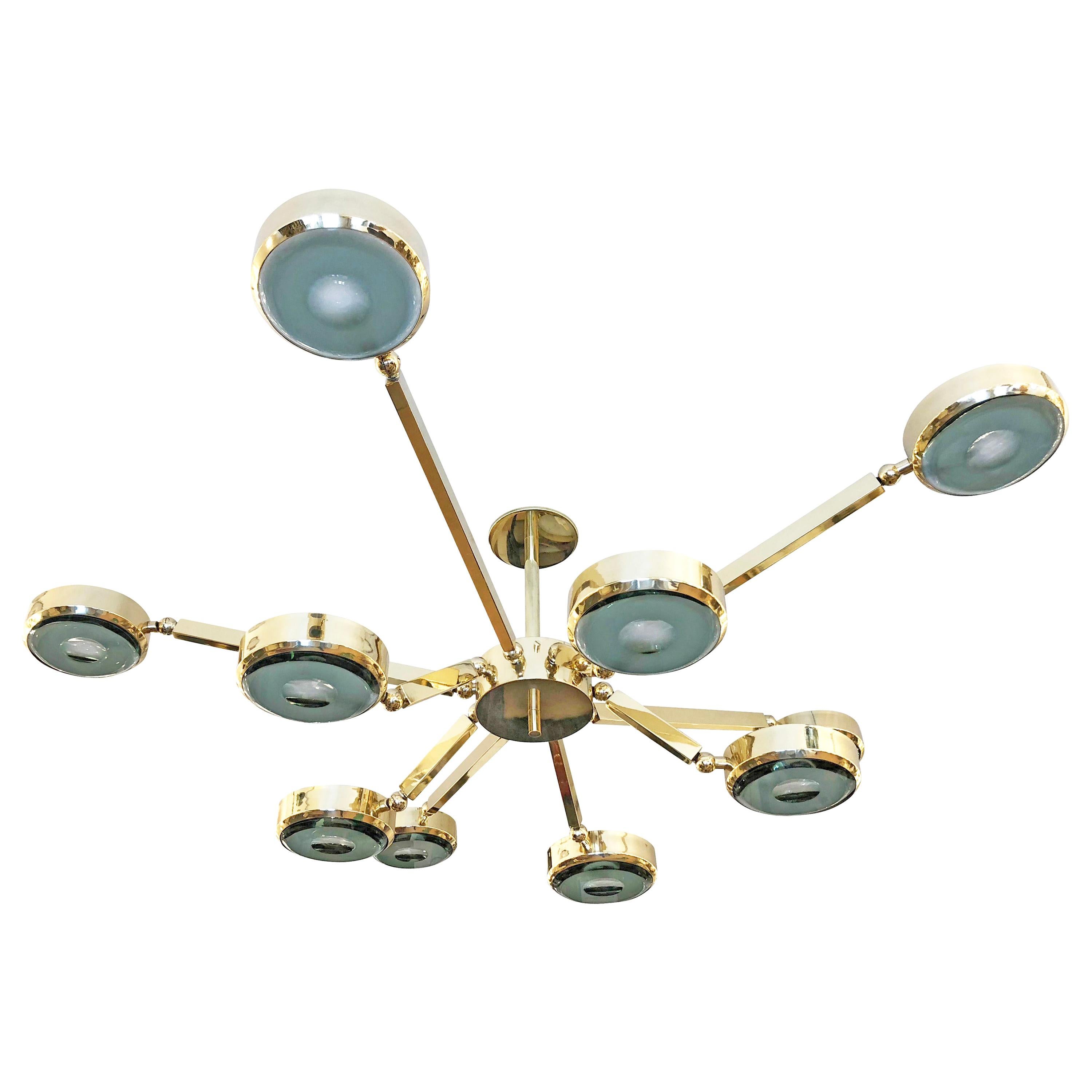 Oculus Articulating Ceiling Light- Polished Brass Finish and Carved Glass For Sale