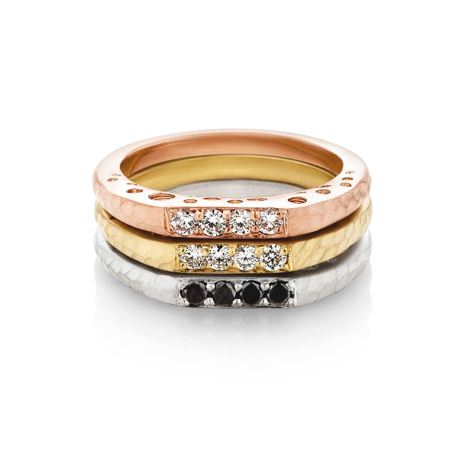 This diamond bar ring features a row of four diamonds bookended by hammered detail. Dots of open space in various sizes and a matte finish align the rings' sides.
An ideal stacking ring, this piece comes as an individual or as a set of three. 

•