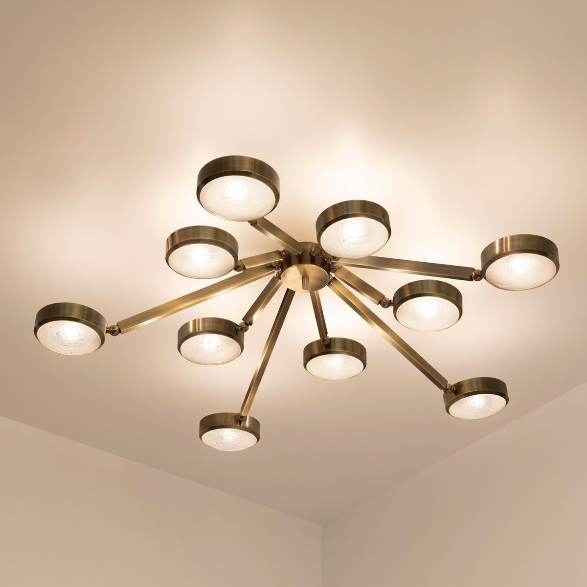 The Oculus ceiling light features an innovative articulating design that allows the ten arms to have a wide range of motion for endless configurations. The brass constructed frame can be flush mounted or installed on a stem.
The first images show