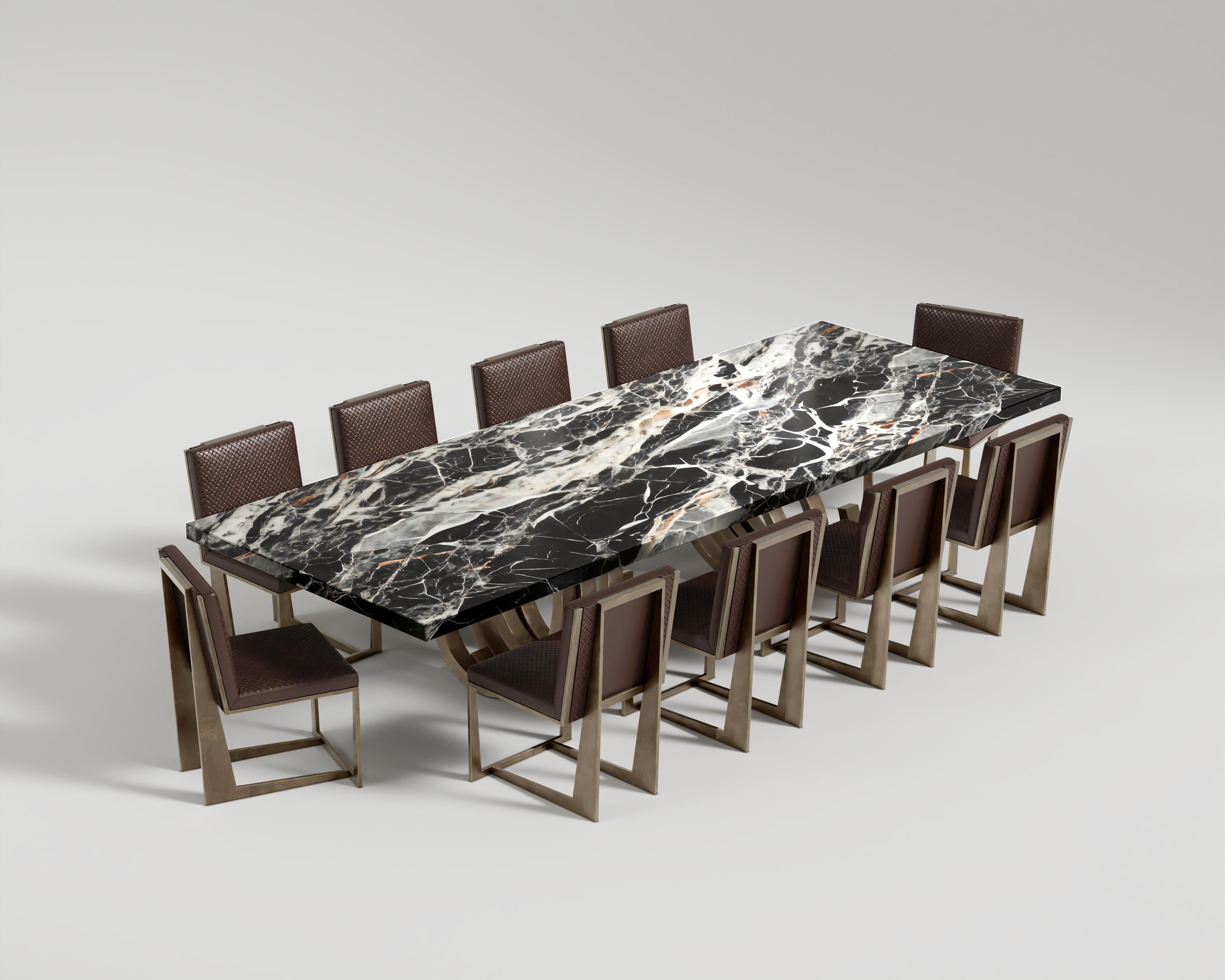 Oculus Dining Table Patina Bronze
The Oculus Dining Table stands as a testament to artisanal craftsmanship and opulent design. Its centerpiece is a one-of-a-kind marble slab tabletop, distinguished by its uniquely patterned and textured surface,